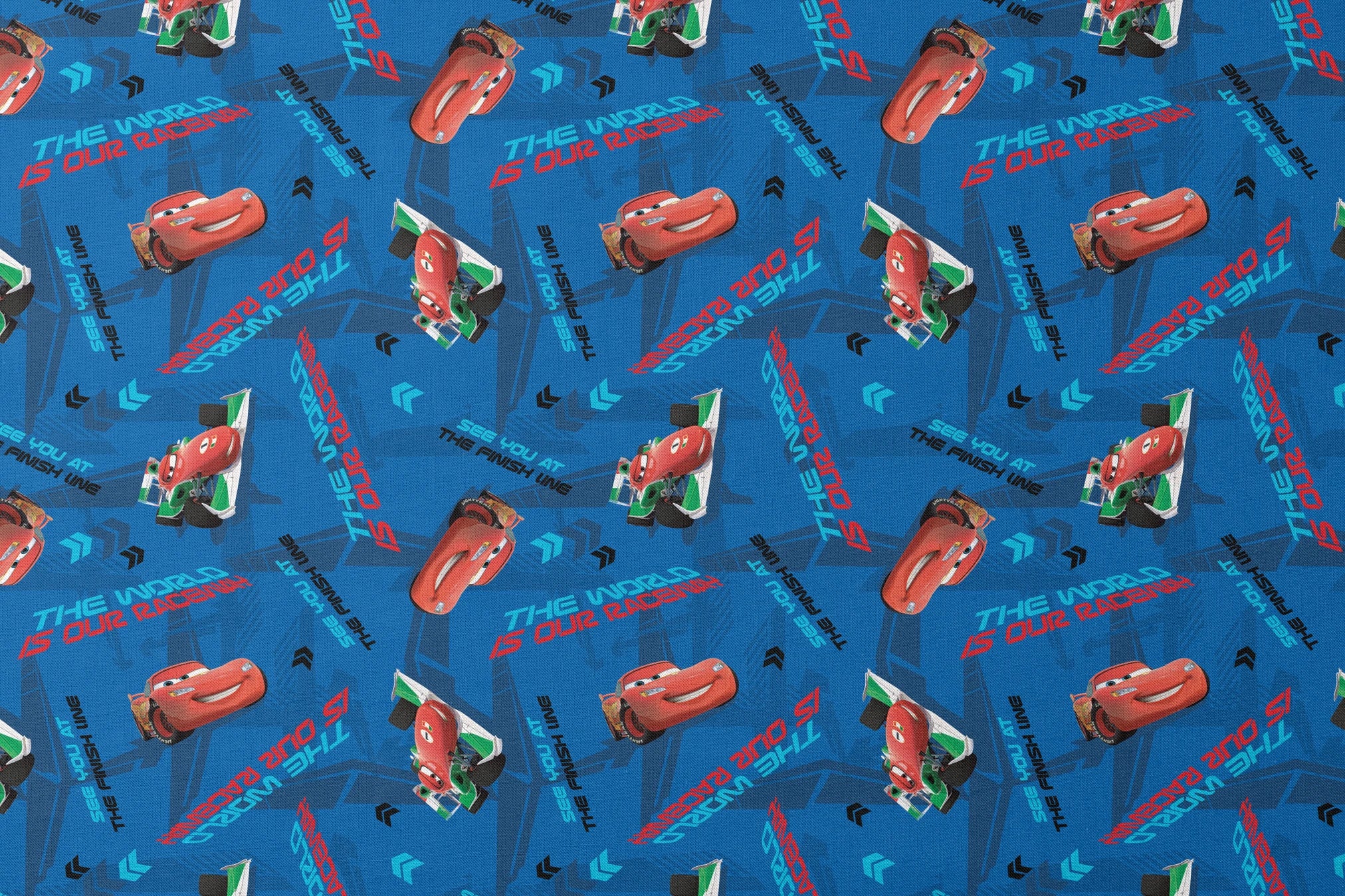 Blue fabric pattern with animated red race cars, "The World of Cars" text, and directional arrow designs designs flat mockup