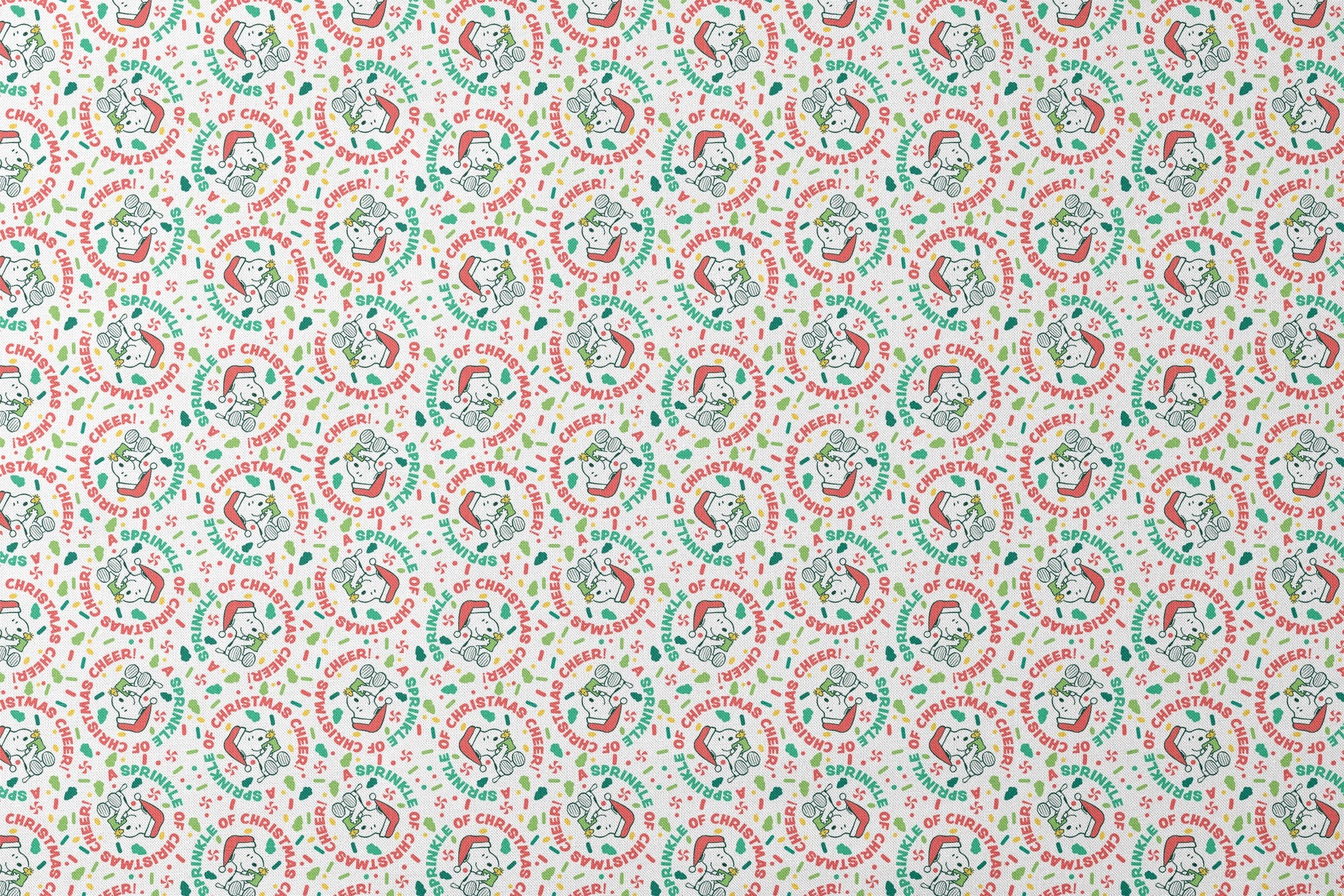 Holiday pattern with Snoopy wearing Santa hat, surrounded by "Merry Christmas", "Cheer", and candy designs on white background designs flat mockup