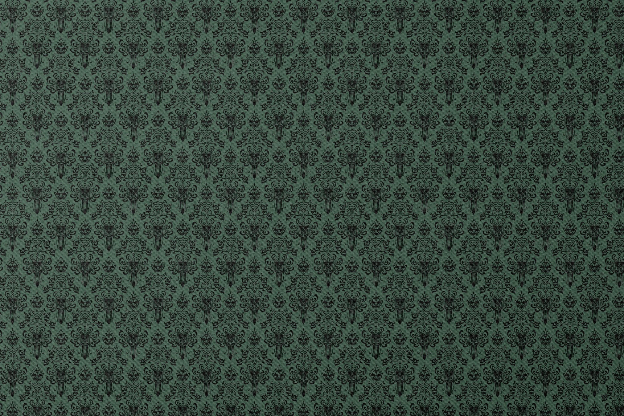 The image shows an elegant Victorian or Gothic-style damask pattern in black against a dark green background. The repeating ornate design features intricate scrollwork, flourishes, and symmetrical decorative elements arranged in a traditional wallpaper or textile pattern style. designs flat mockup