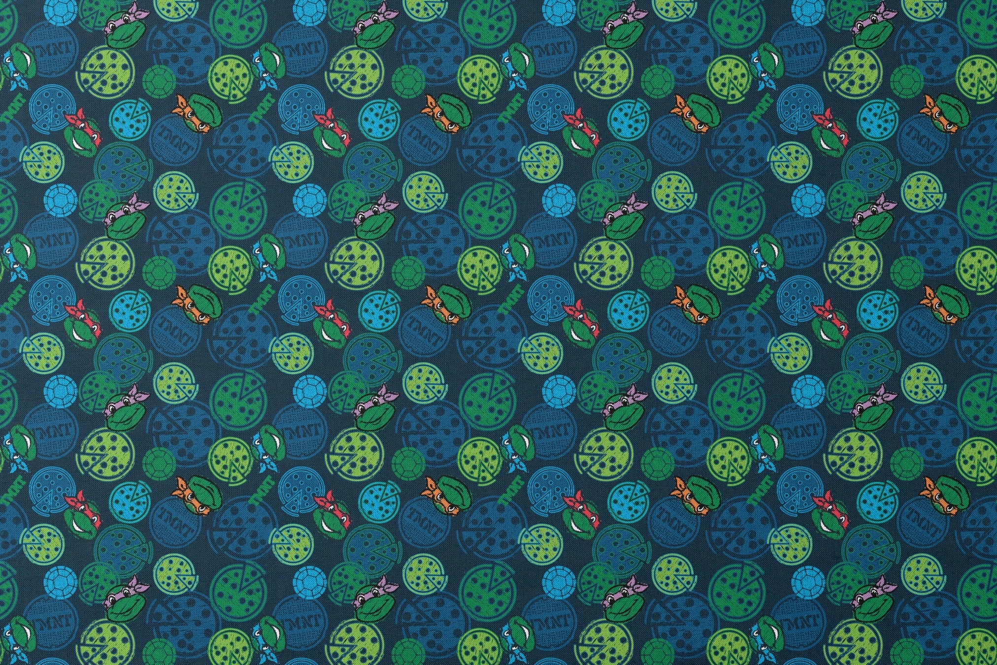 Teenage Mutant Ninja Turtles pattern with cartoon character heads and green/blue pizza circles designs flat mockup