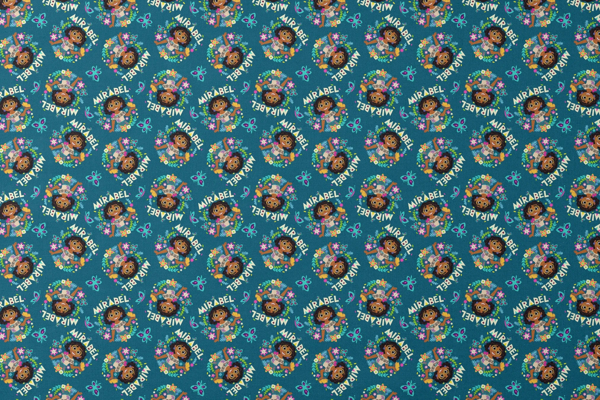 Colorful cartoon pattern on teal background featuring characters, butterflies, flowers, and "Mirabel" text in repeating design designs flat mockup