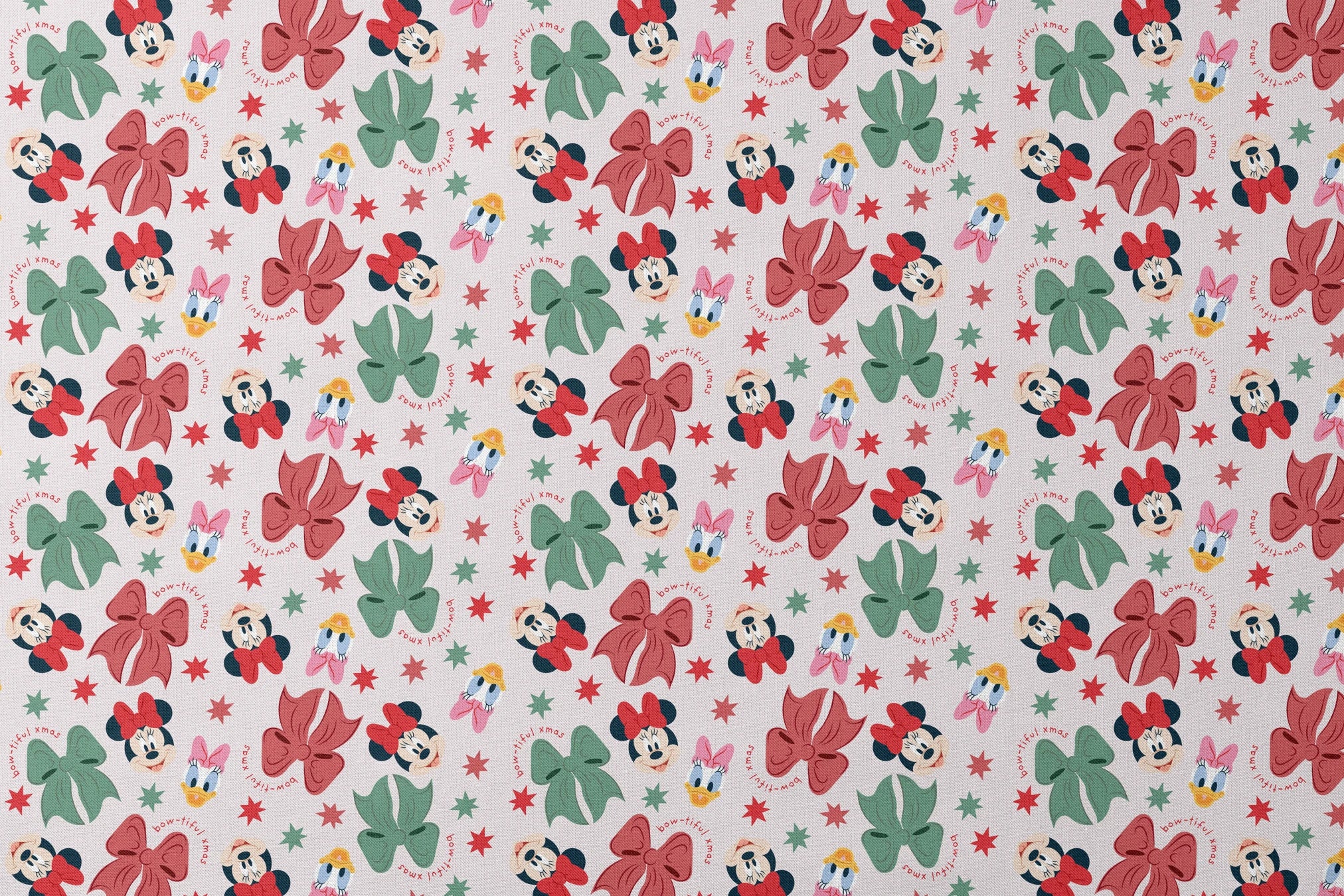 Disney pattern with Minnie Mouse and Daisy Duck characters, green and red bows, and green stars on light background. designs flat mockup
