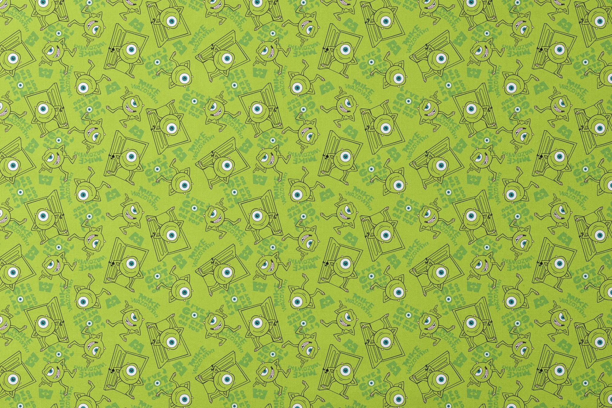 Green background with repeating Mike Wazowski in black outlines. designs flat mockup