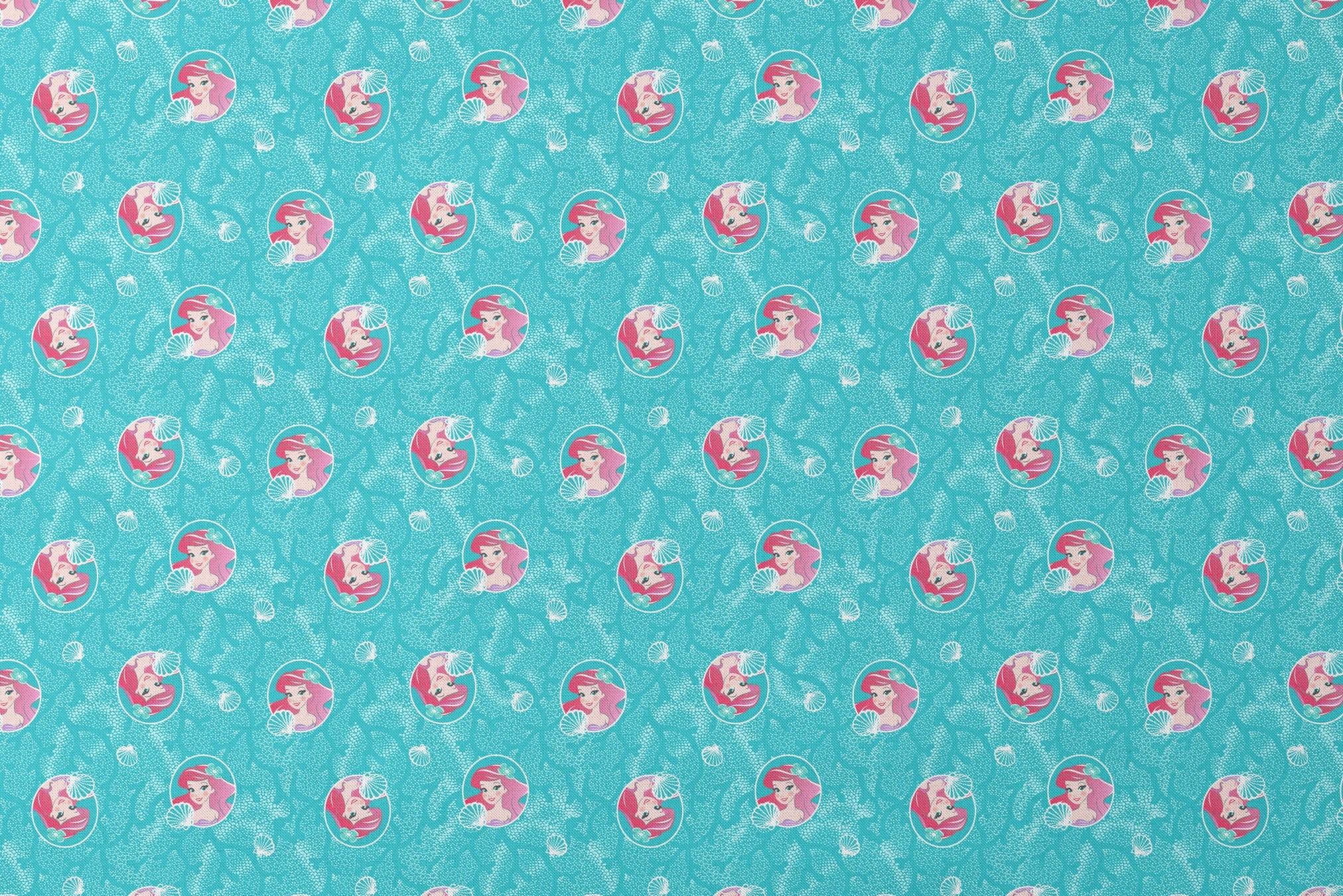 The Little Mermaid pattern with Ariel in turquoise circles on aqua background with seashells designs flat mockup