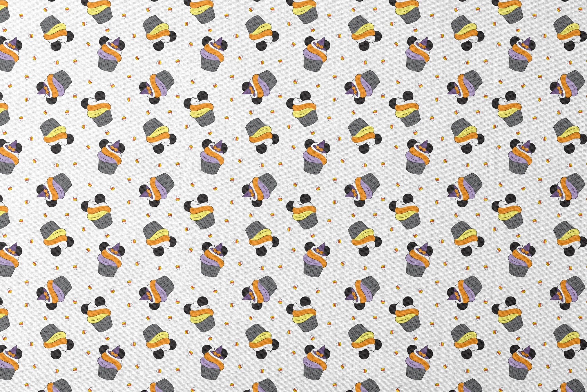 Disney cupcakes with black circular elements and colorful frosting in orange, yellow, and purple on a white background. designs flat mockup