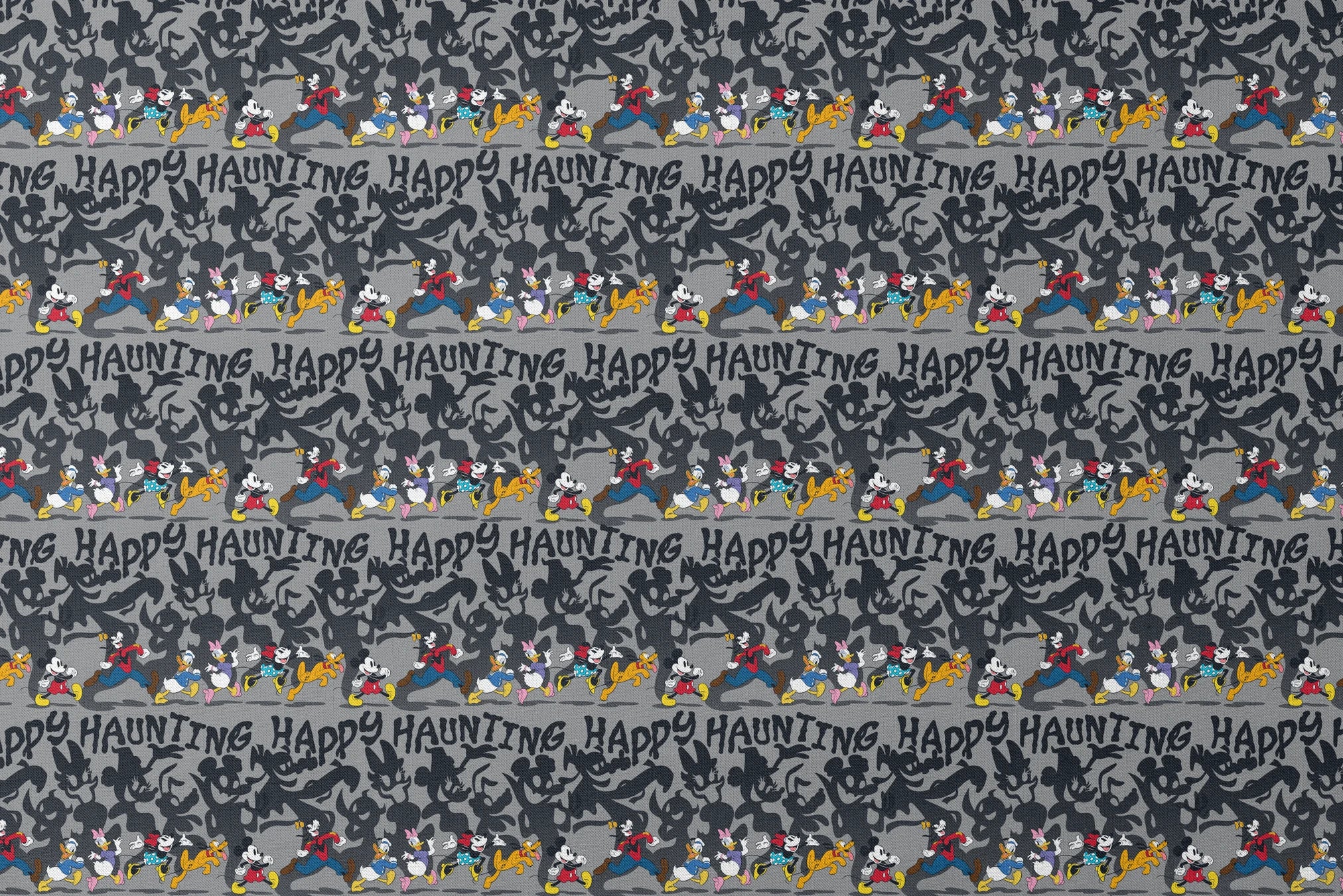 Classic Disney characters on dark gray background with "Happy Haunting" text, Mickey, Donald, and friends in Halloween-themed poses. designs flat mockup