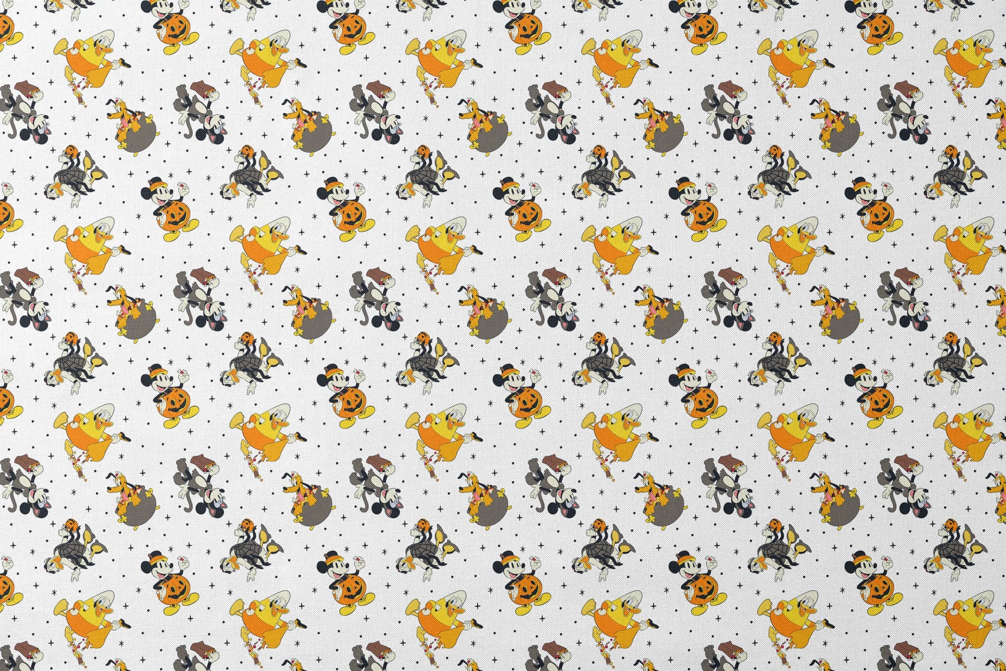 Disney characters in Halloween costumes on white background with stars - Mickey, Pluto, and friends in festive attire designs flat mockup