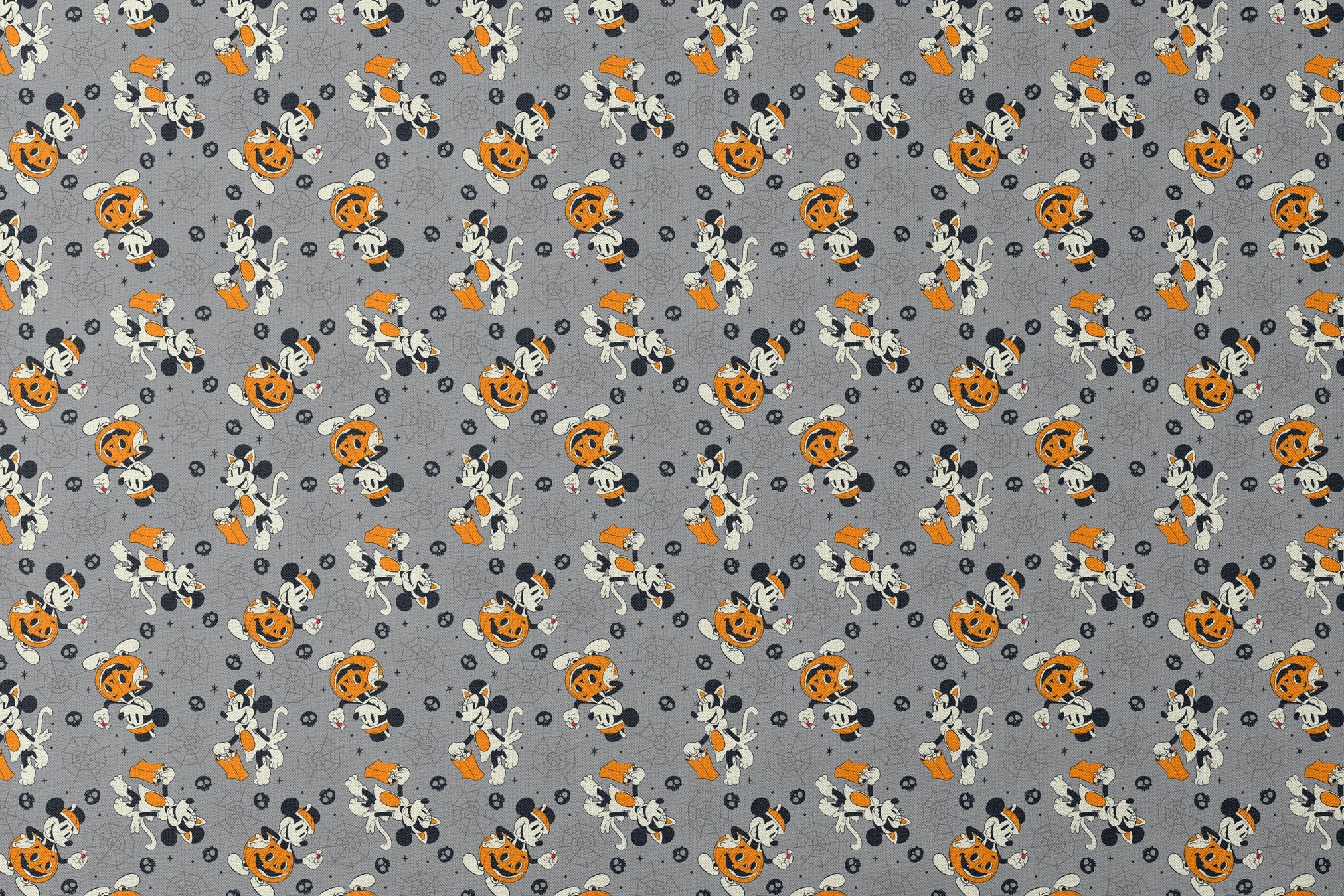 Cartoon dog characters in Halloween costumes with pumpkins on gray background with spider webs and skulls designs flat mockup