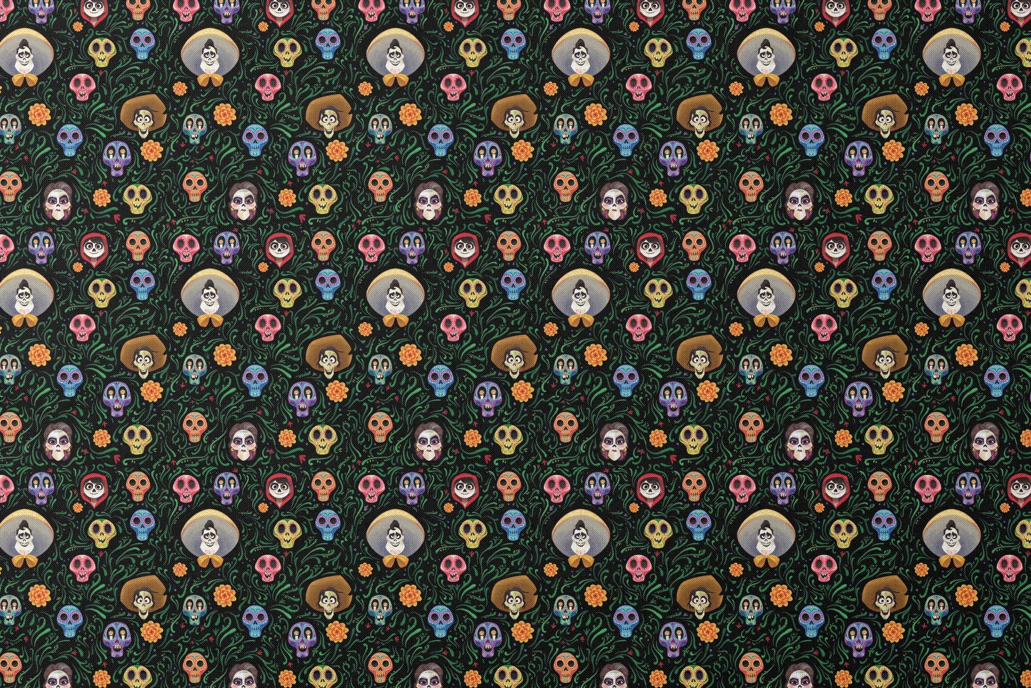 Colorful Coco stylized sugar skulls with sombreros scattered among green vines and orange flowers on black background designs flat mockup