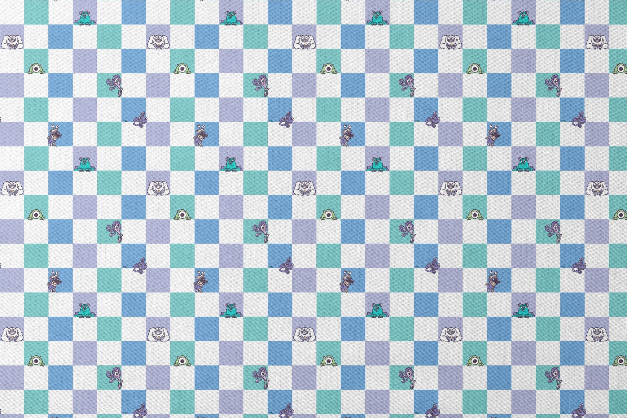 Monsters Inc characters on a checkered pattern of white, mint green, light purple, and blue squares designs flat mockup