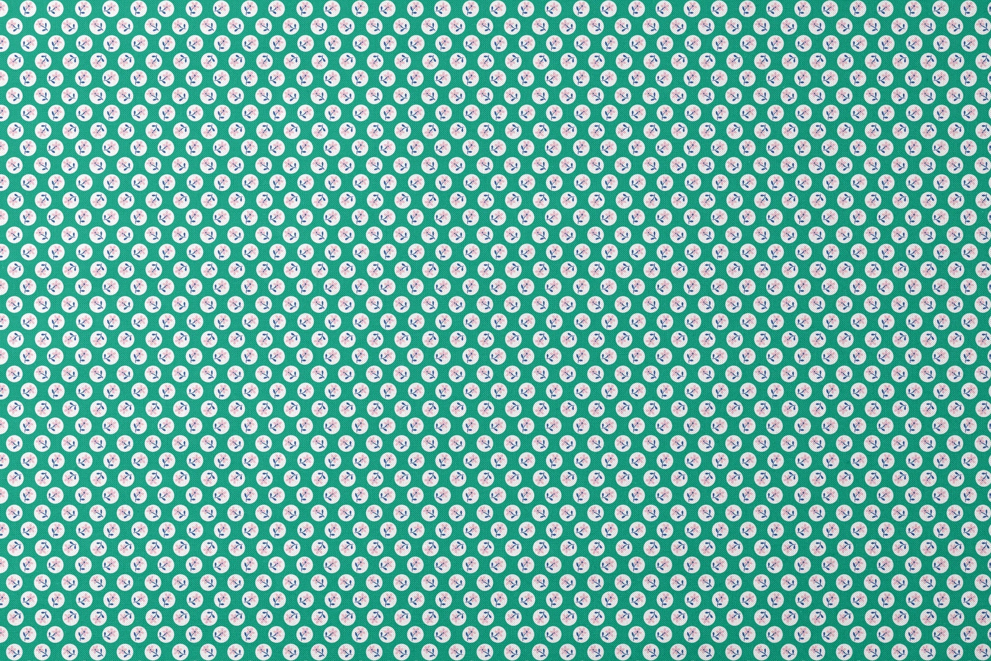 Pink flower motifs with blue stems on white circles against a green background designs flat mockup