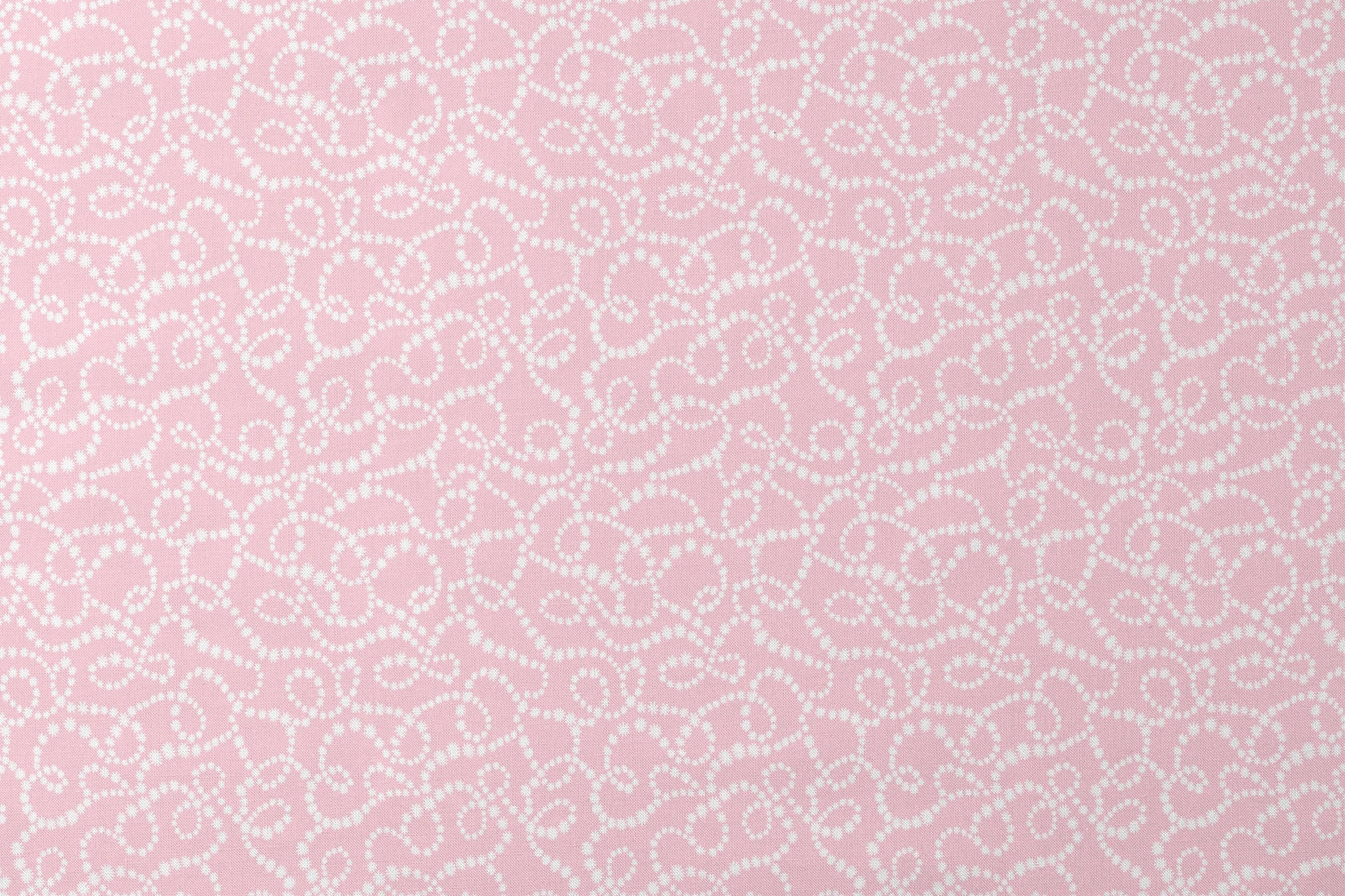 Baby pink background with white dotted swirling pattern creating delicate curved lines and loops designs flat mockup