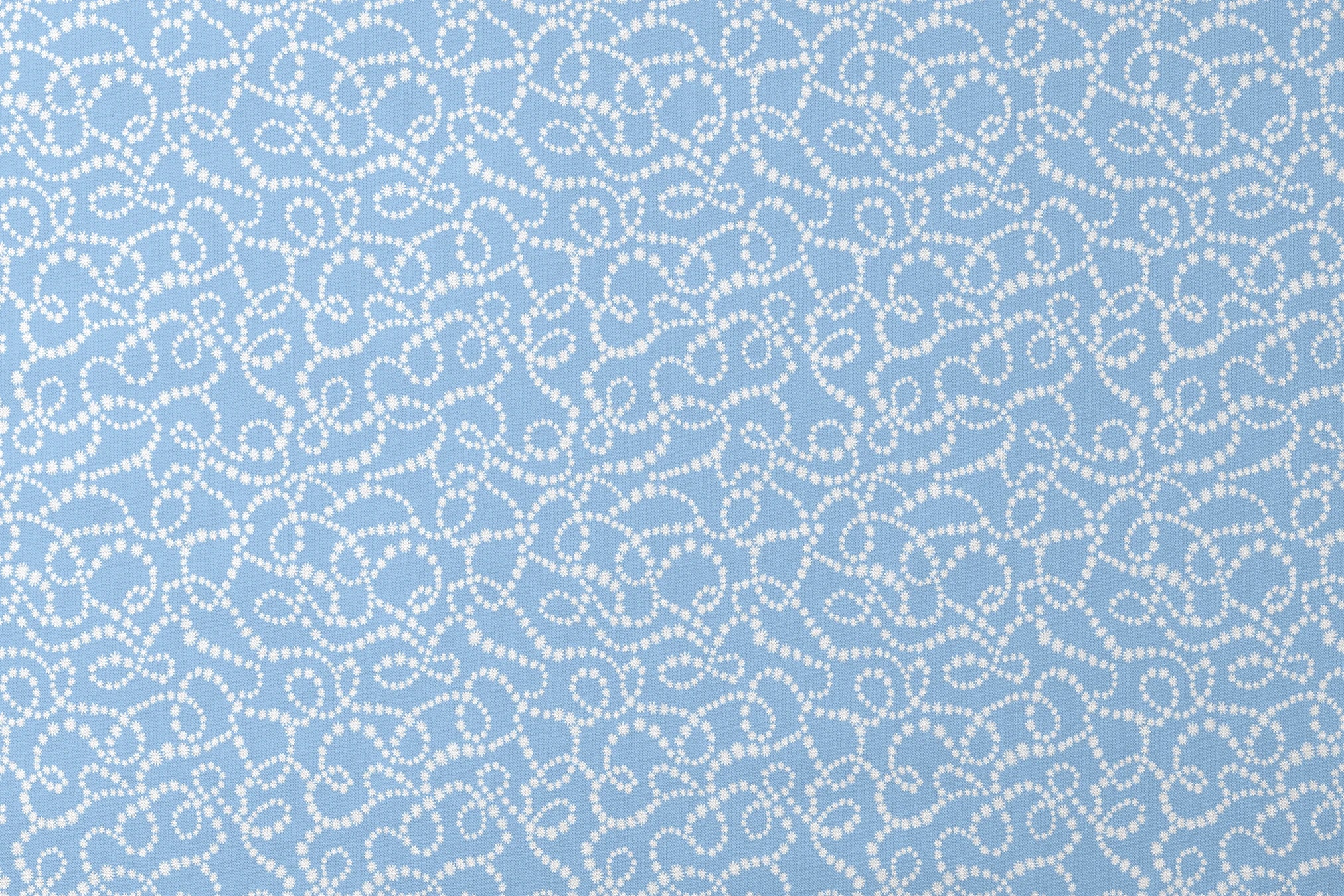 Pale blue background with white dotted swirling pattern resembling strings of pearls or bubbles in abstract curves designs flat mockup