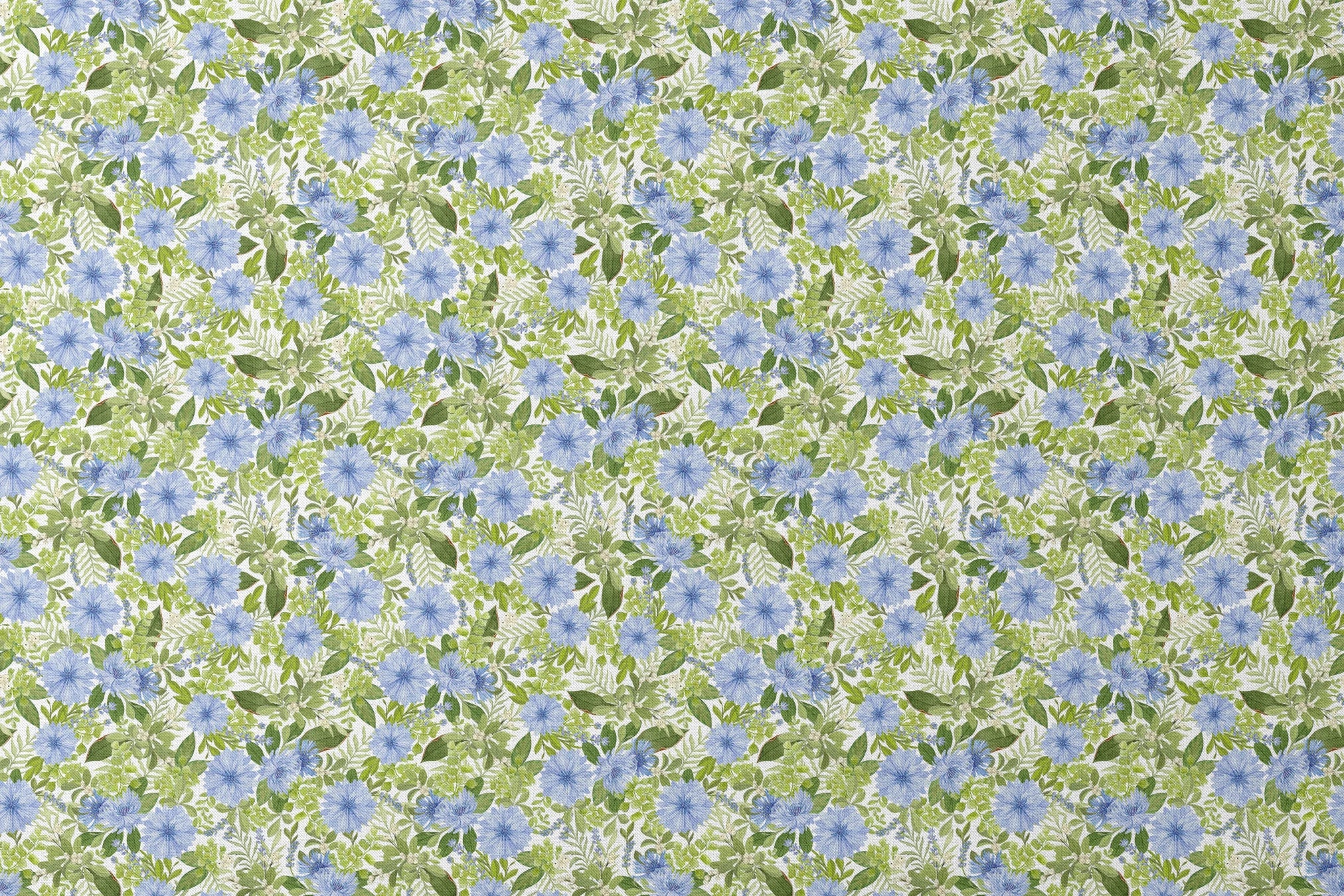 Watercolor-style botanical fabric pattern featuring blue wildflowers and soft green foliage on a white background. Designed by Nicole Tamarin. designs flat mockup