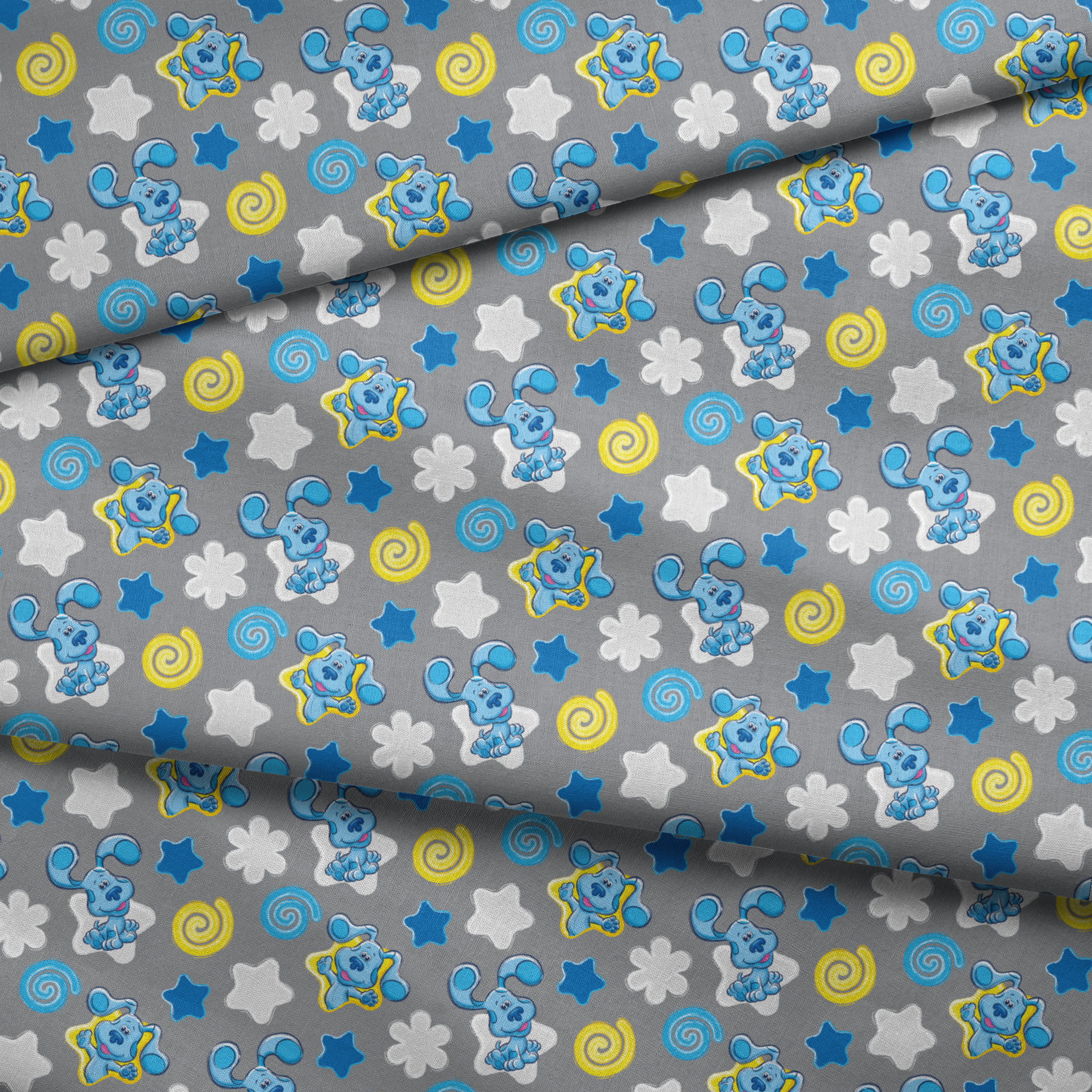 Blue cartoon elephants with stars, swirls, and clouds pattern on gray background fabric fold mockup