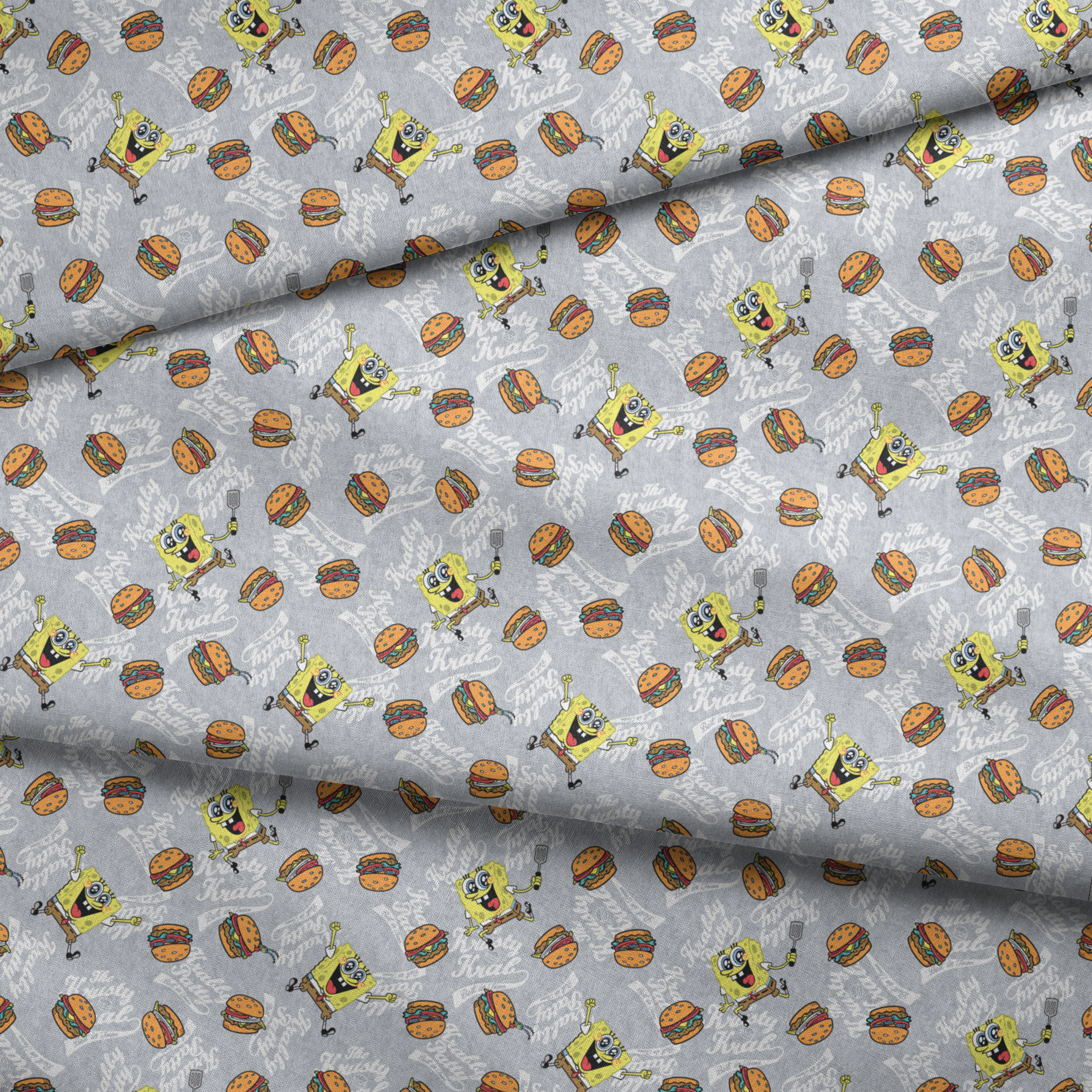 SpongeBob surrounded by Krabby Patties, spatulas, and “The Krusty Krab” text on a heather gray background in a playful cartoon-style design. fabric fold mockup