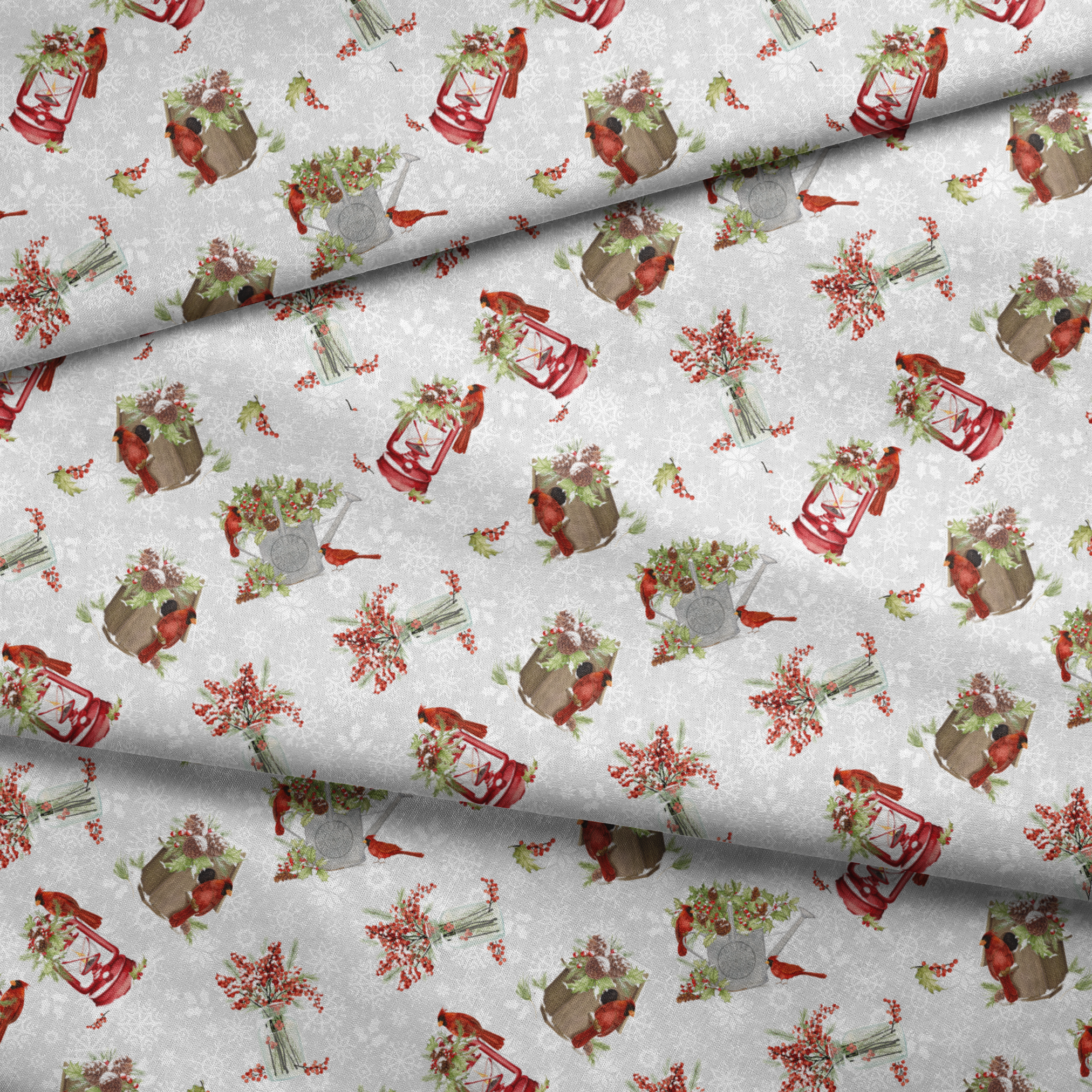 Red cardinals perched among holly berries, pine sprigs, lanterns, and rustic containers on a soft snowy background with snowflake details by Nicole Tamarin fabric fold mockup
