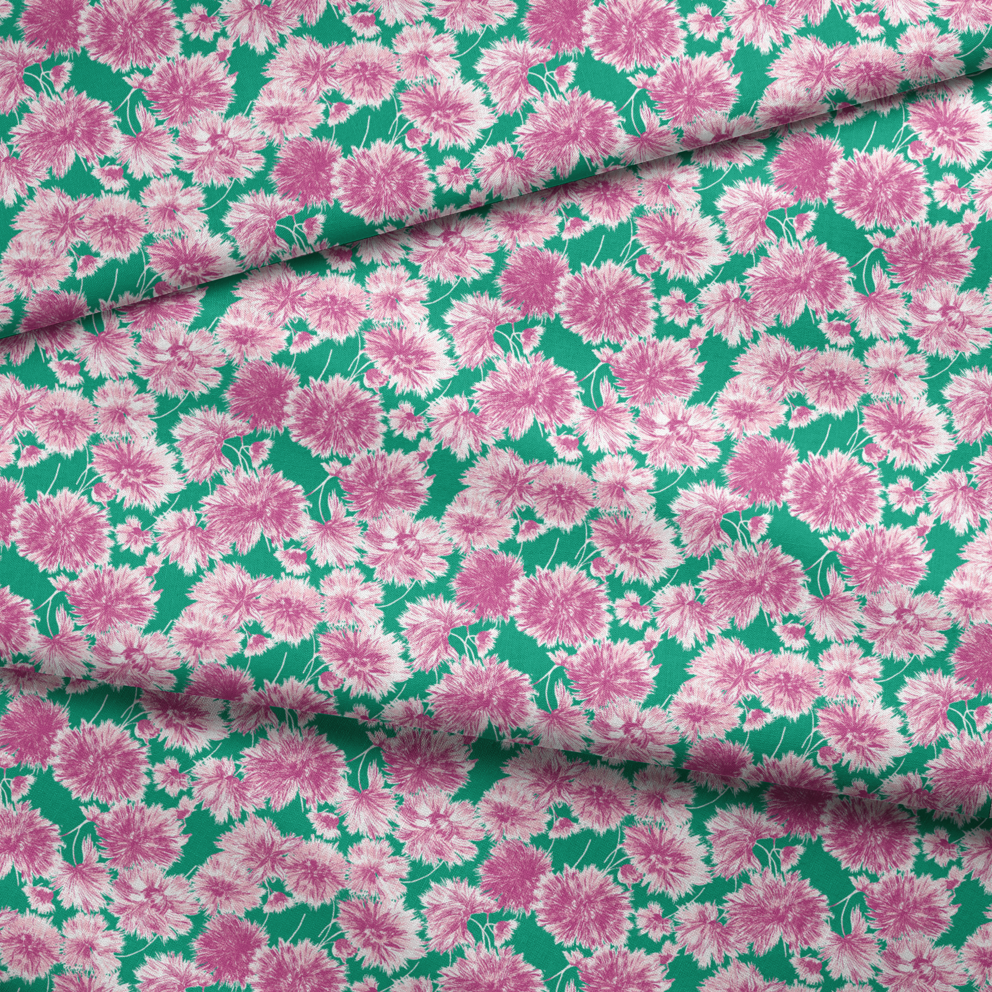 Pink and purple carnation flowers scattered on a green background in a repeating floral pattern fabric fold mockup