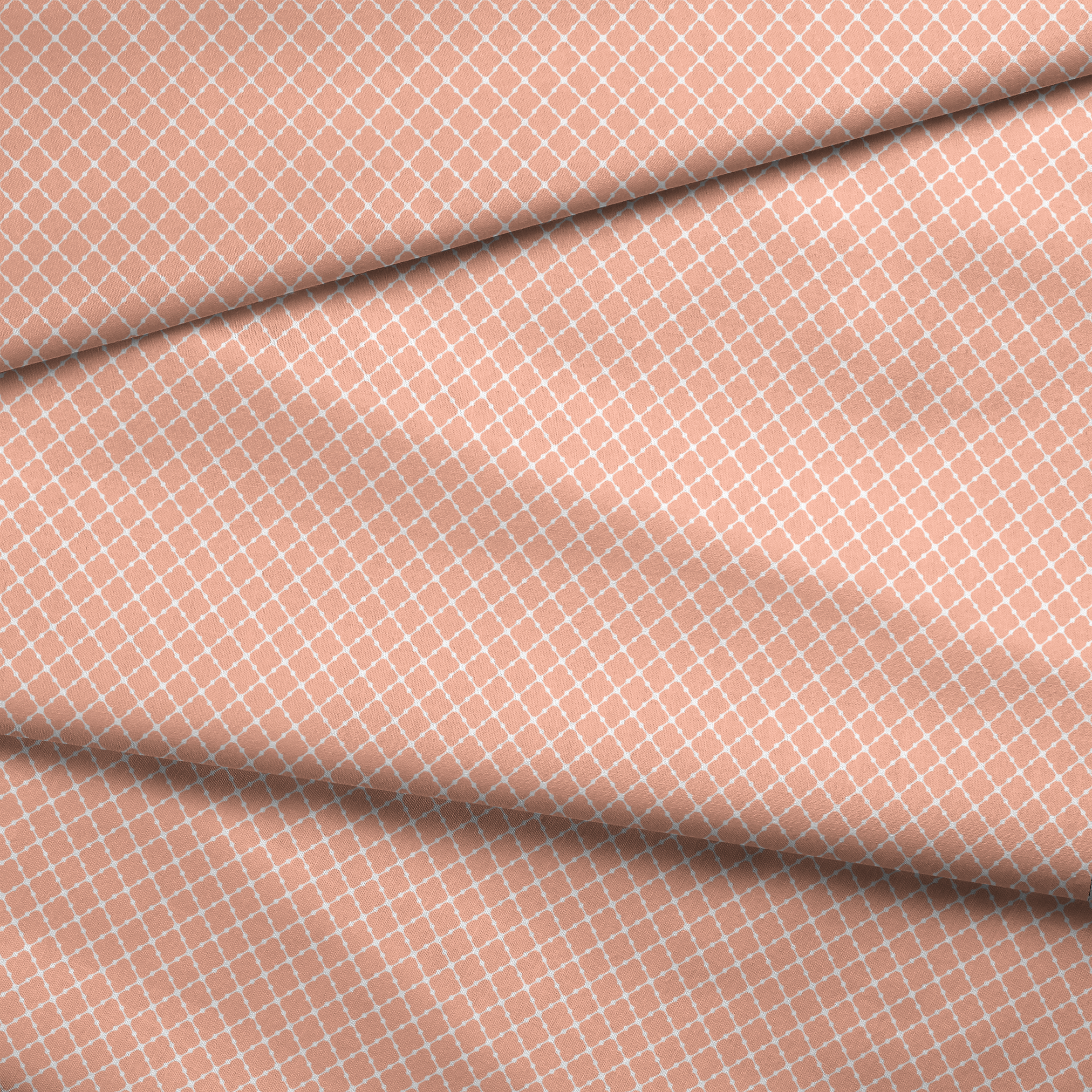 Peach and white quatrefoil pattern with regular geometric shapes in a lattice arrangement fabric fold mockup