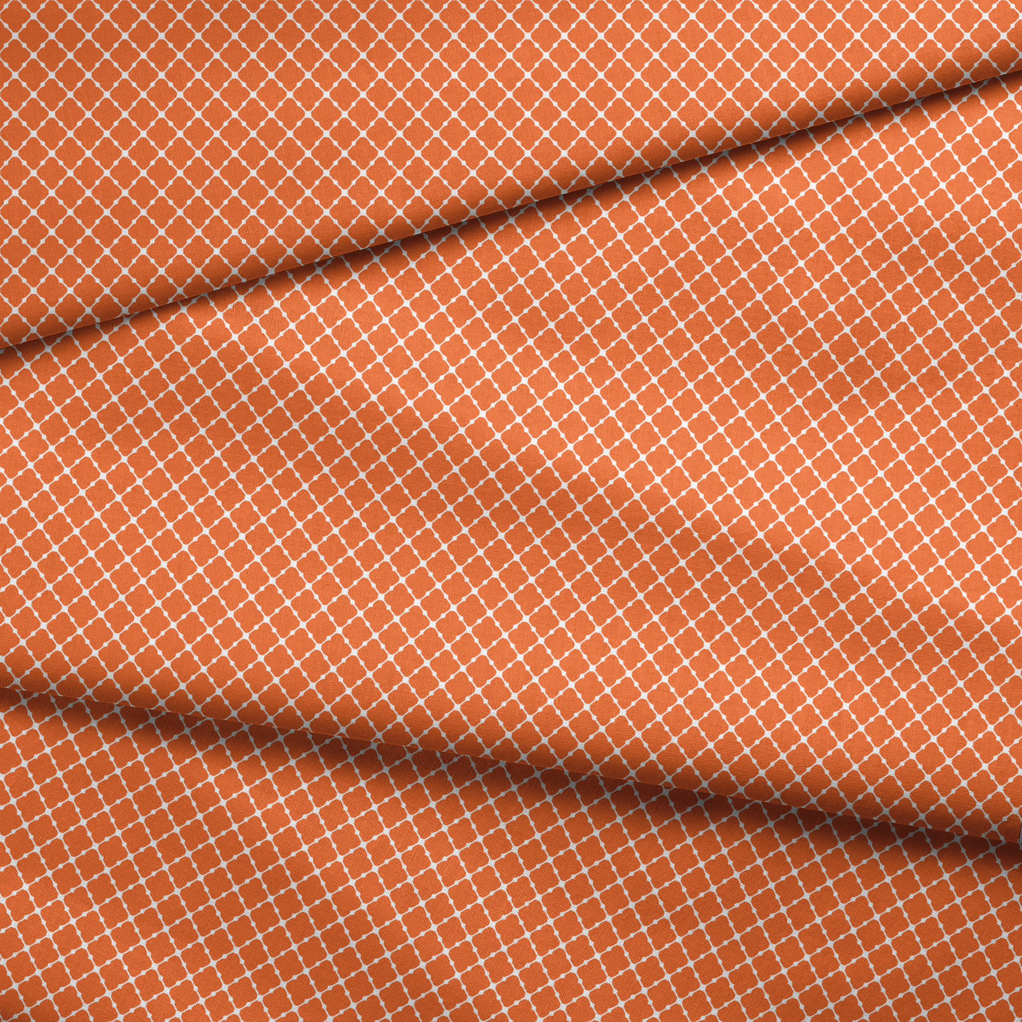 Burnt Orange and white quatrefoil pattern with smooth lattice design on orange background fabric fold mockup