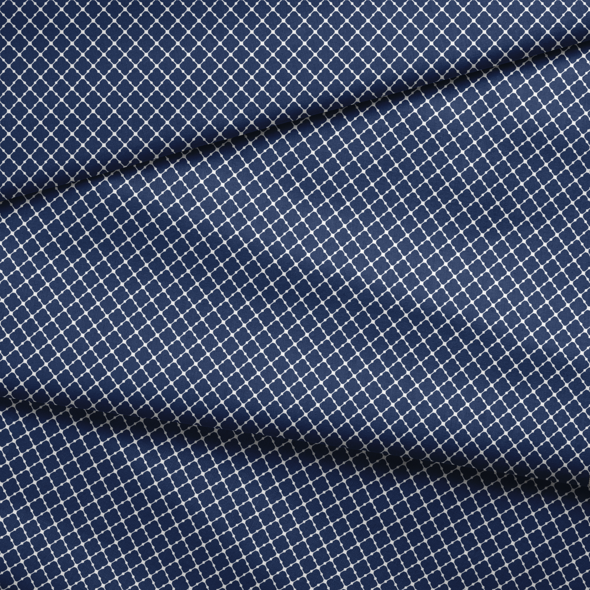 Navy blue quatrefoil pattern with white lattice design on dark background fabric fold mockup