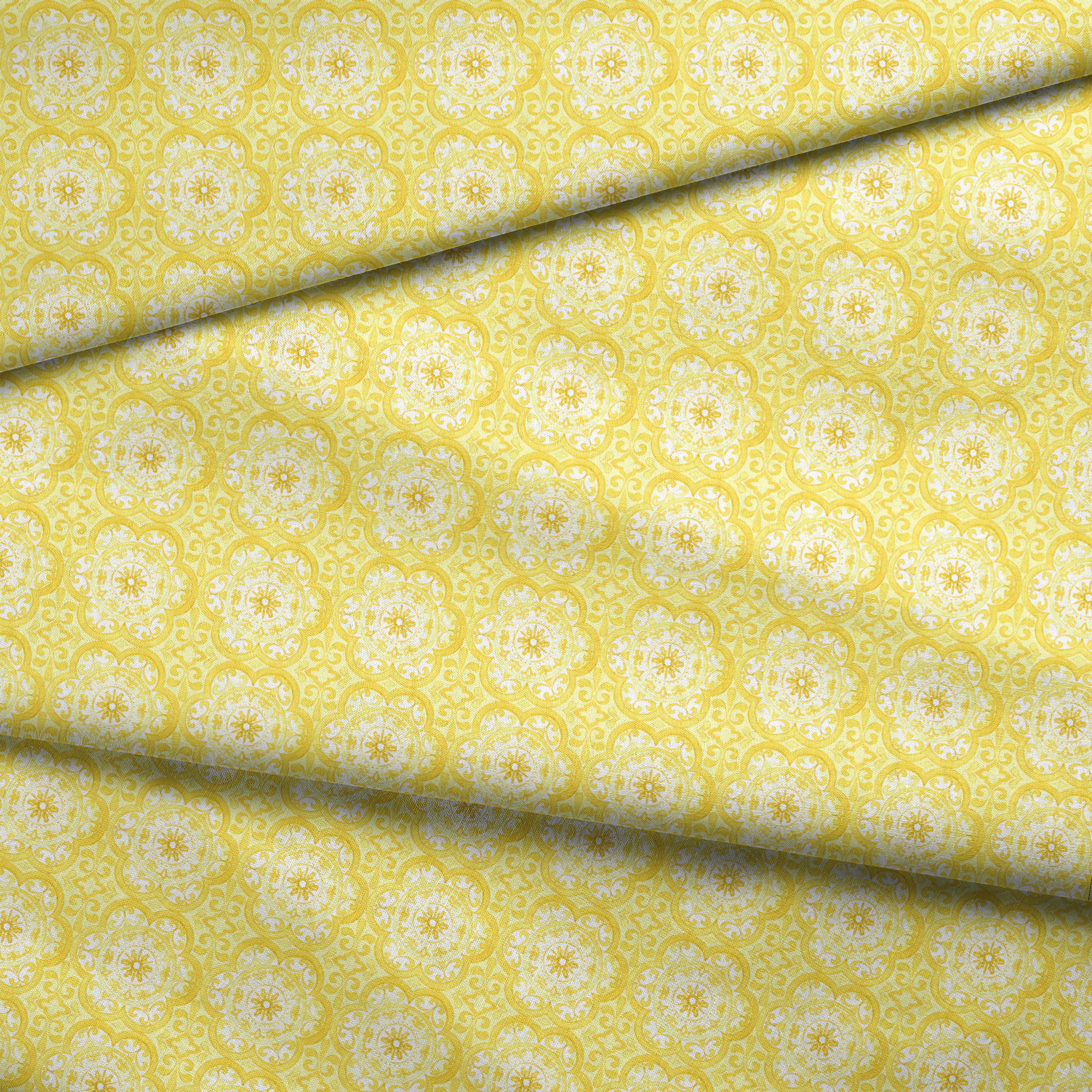 Bright yellow decorative pattern with white floral medallions in repeating ornamental design fabric fold mockup