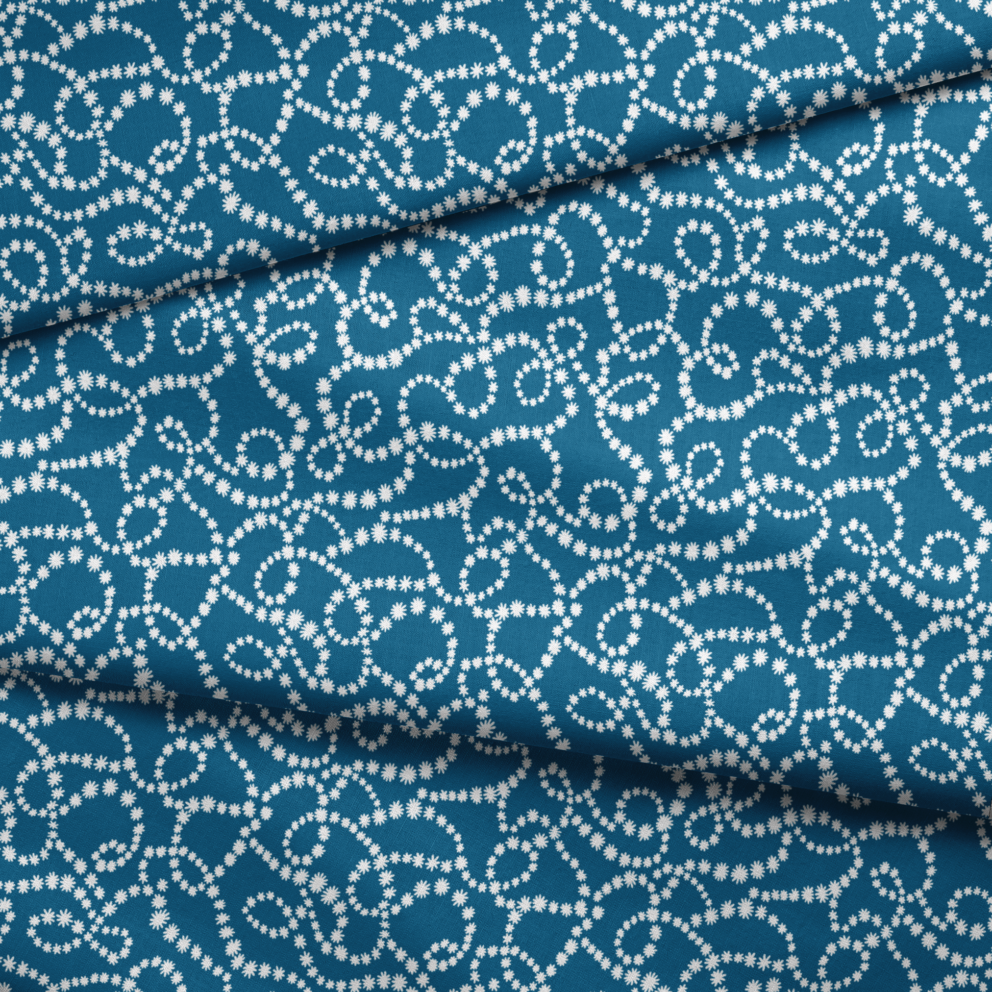 Dotted white swirling patterns on deep teal blue background creating abstract curved designs fabric fold mockup
