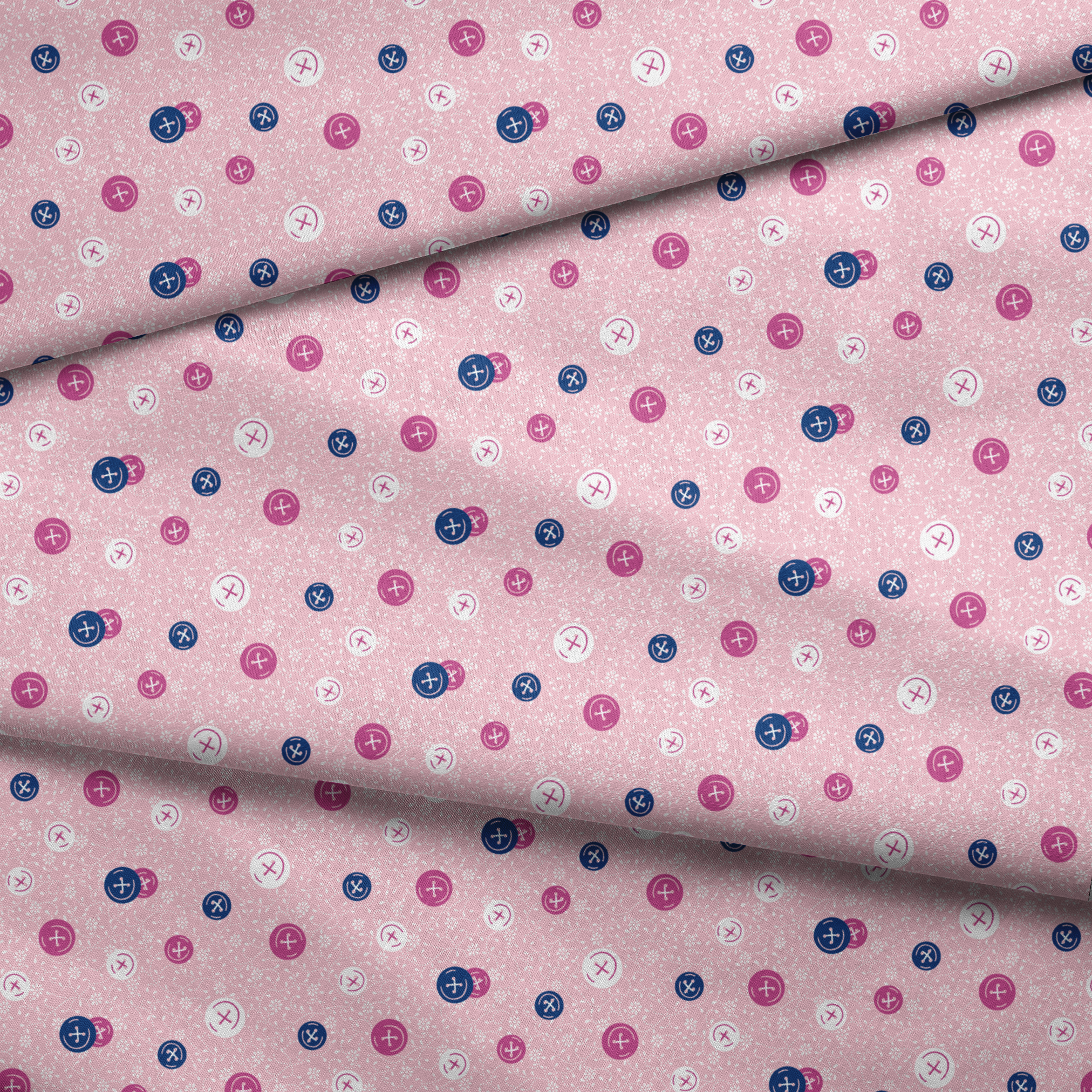 Scattered buttons in white, pink, and navy on a light pink floral background fabric fold mockup