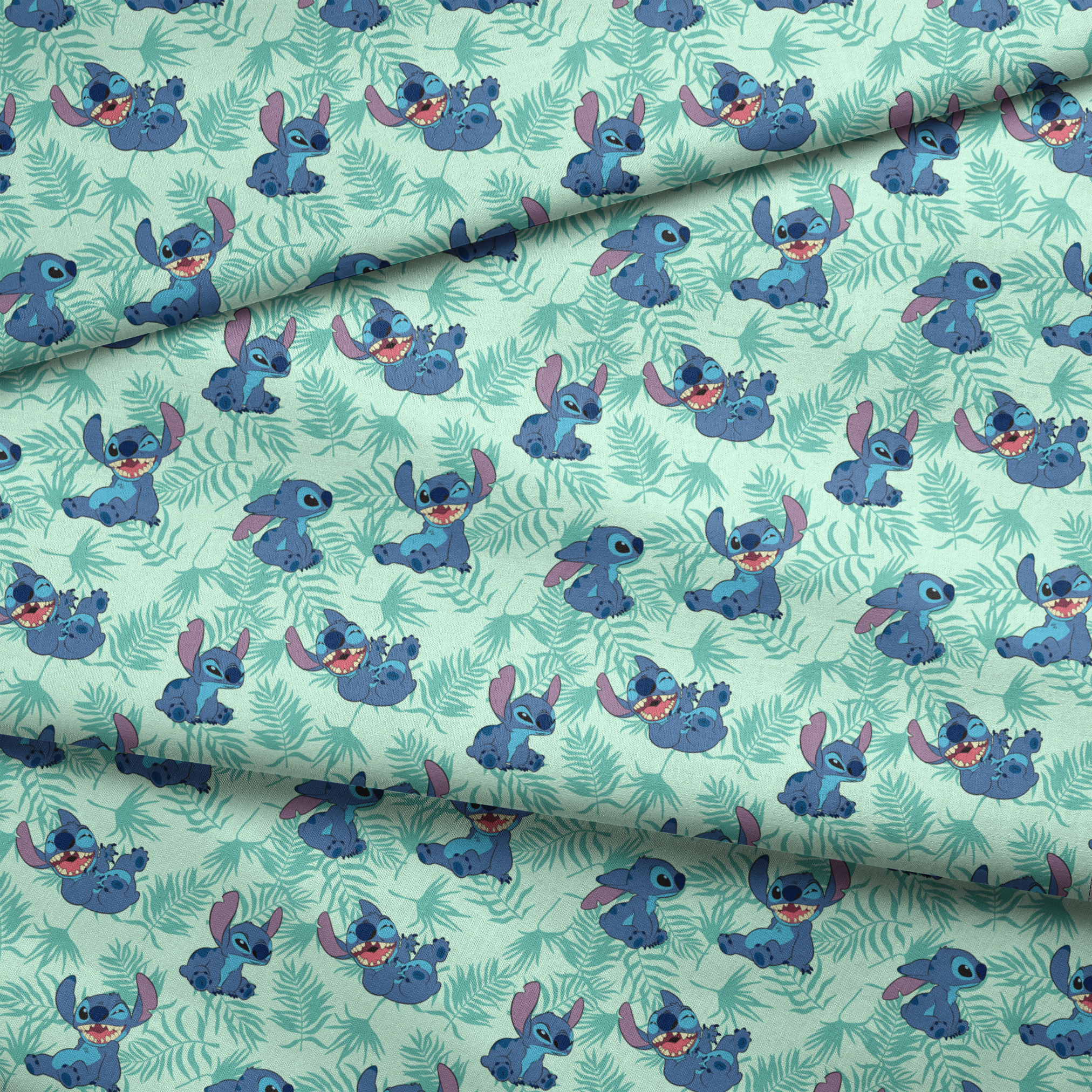 Blue cartoon alien character Stitch in various playful poses against mint green tropical leaf pattern background fabric fold mockup