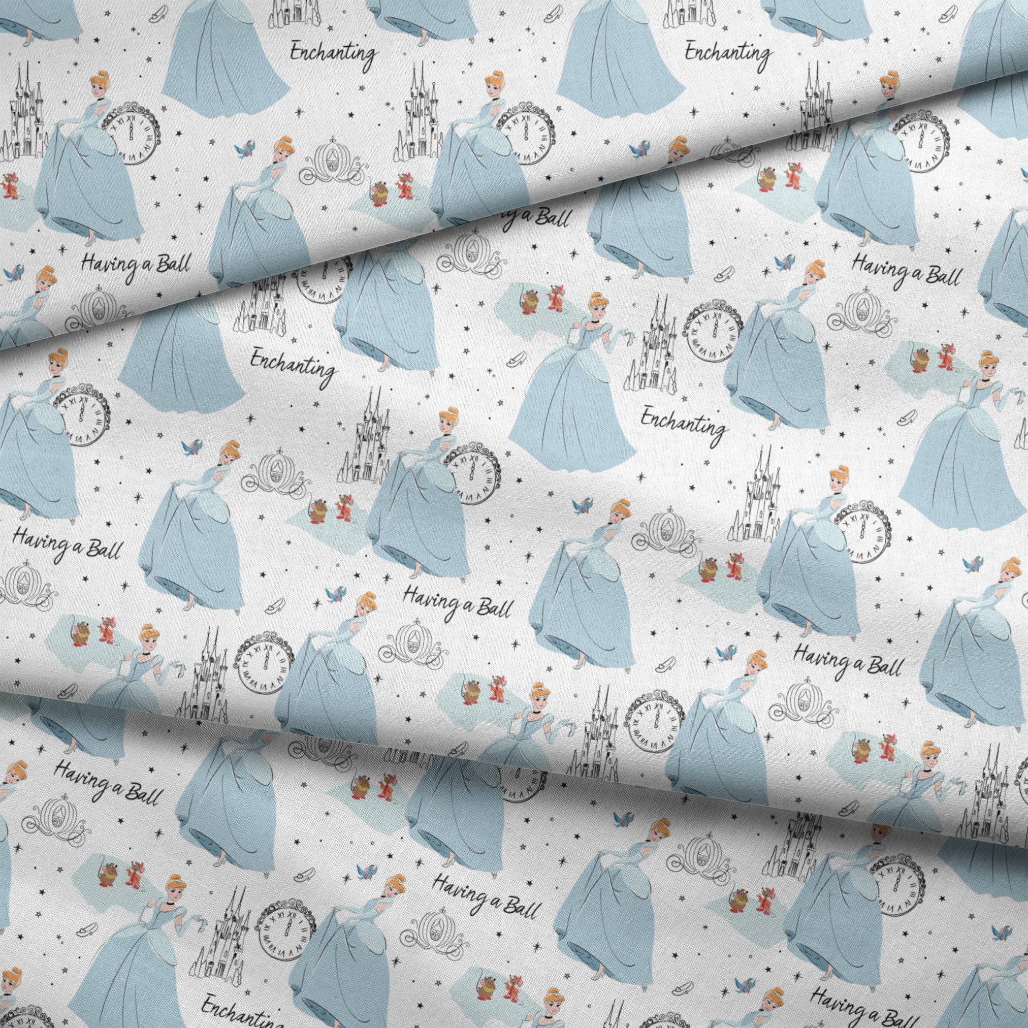 Whimsical pattern featuring cartoon princess in blue gown, clocks, castles, carriages and "Enchanting" text on white background fabric fold mockup