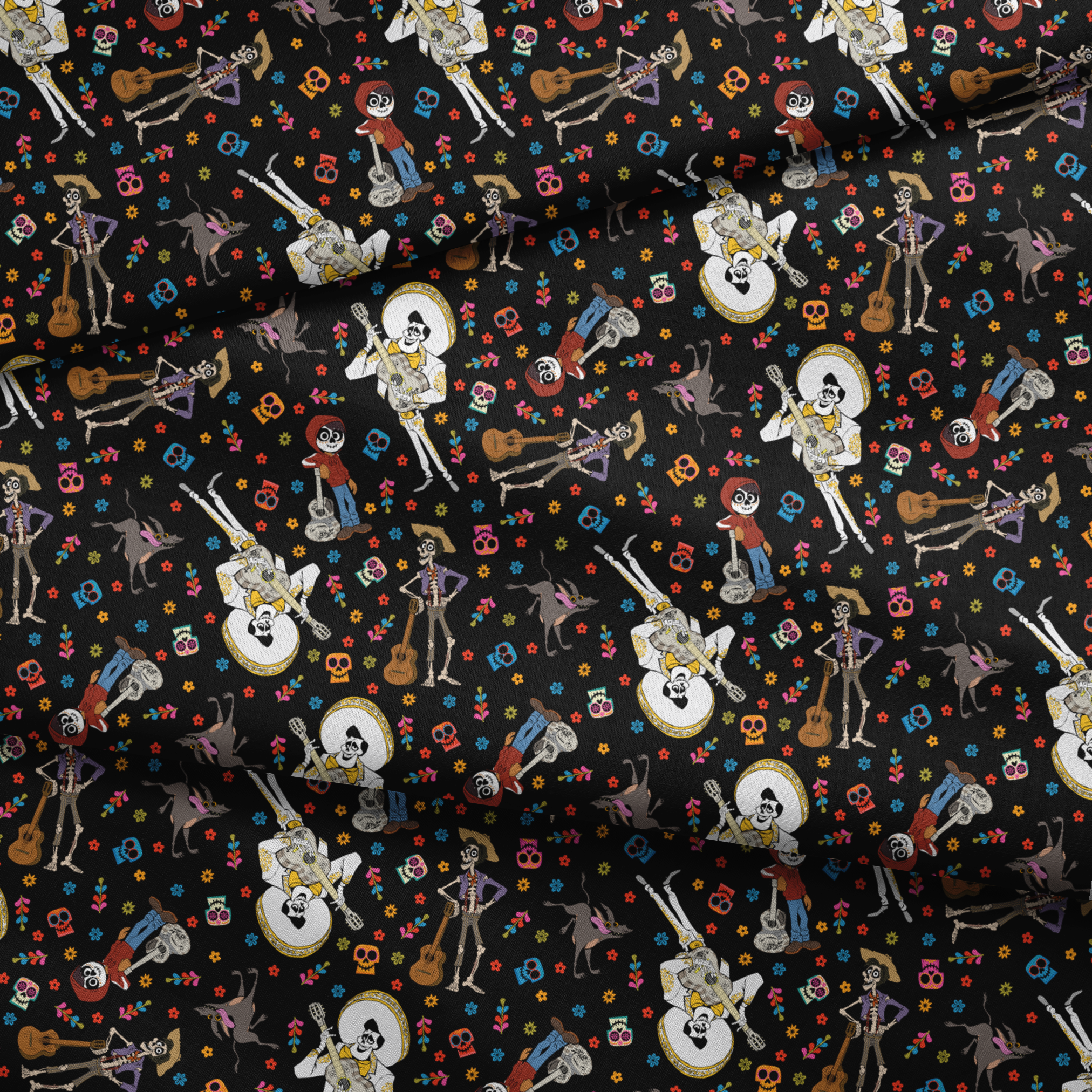 Colorful Coco Day of the Dead pattern with skeleton figures playing instruments, skulls, and flowers on black background fabric fold mockup