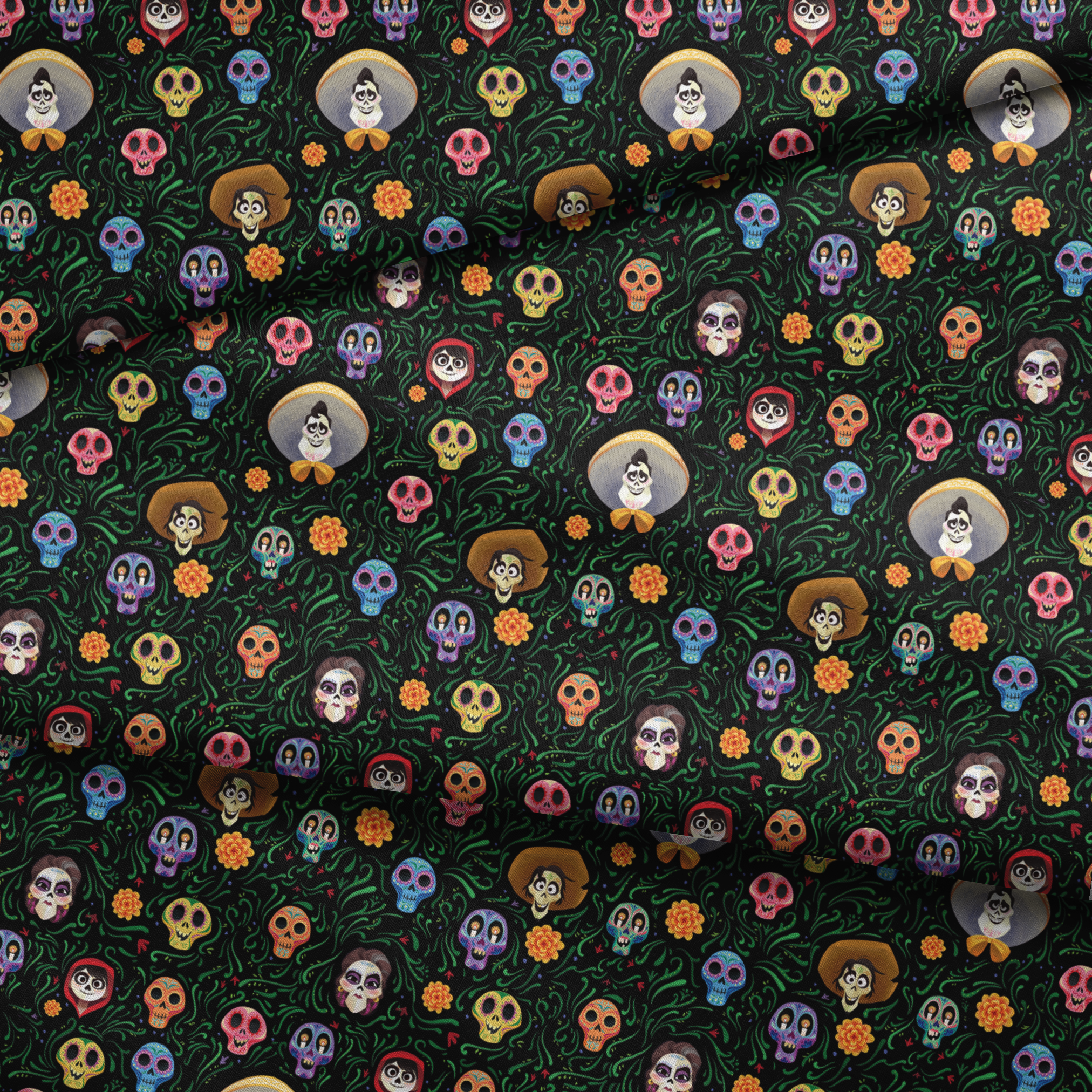Colorful Coco stylized sugar skulls with sombreros scattered among green vines and orange flowers on black background fabric fold mockup