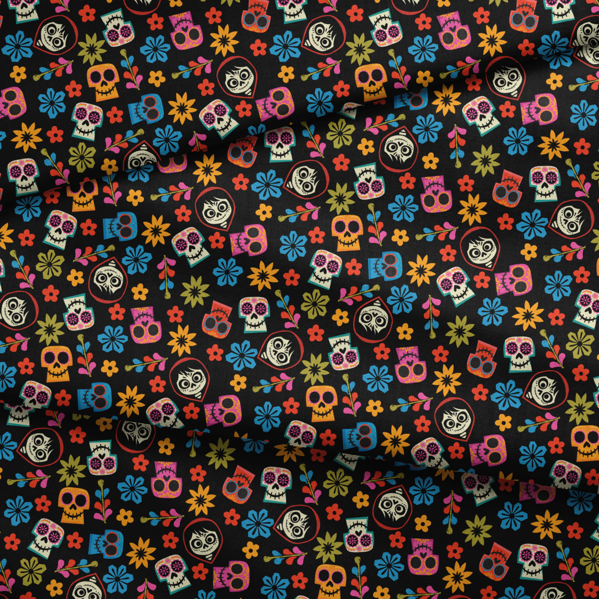 Colorful Coco sugar skull pattern with floral designs on black background for Day of the Dead fabric fold mockup
