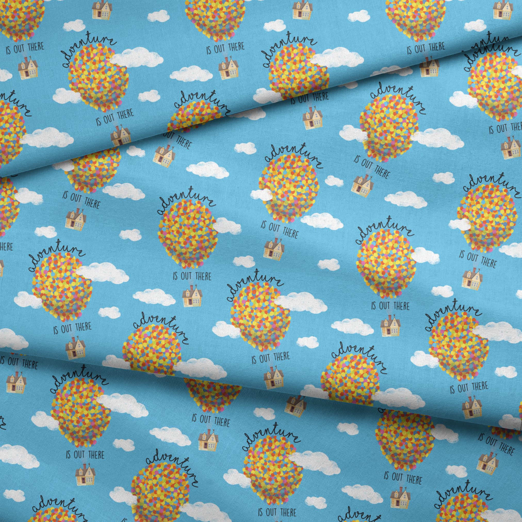 Colorful Up-inspired balloon houses floating in blue sky with text "Adventure is out there" repeating in pattern fabric fold mockup