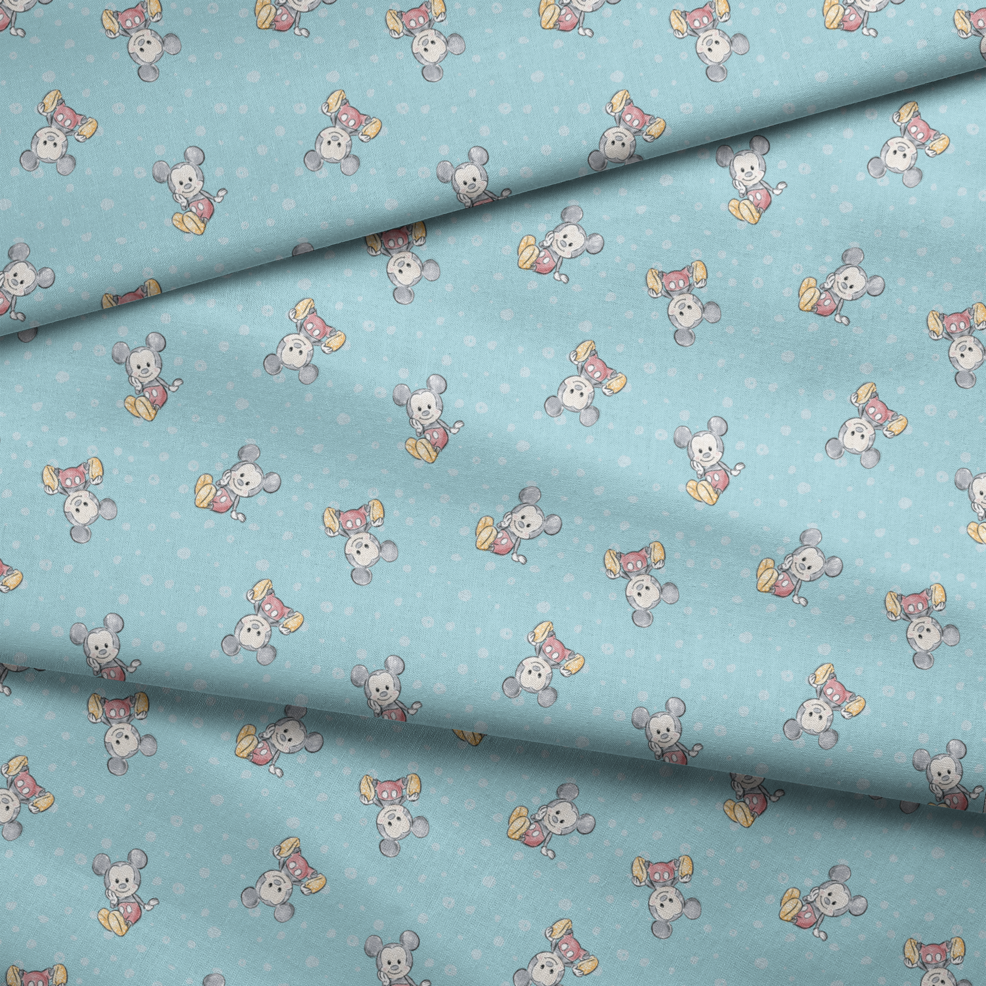 Cute cartoon mouse pattern with gray mice wearing colorful outfits on light blue polka dot background fabric fold mockup