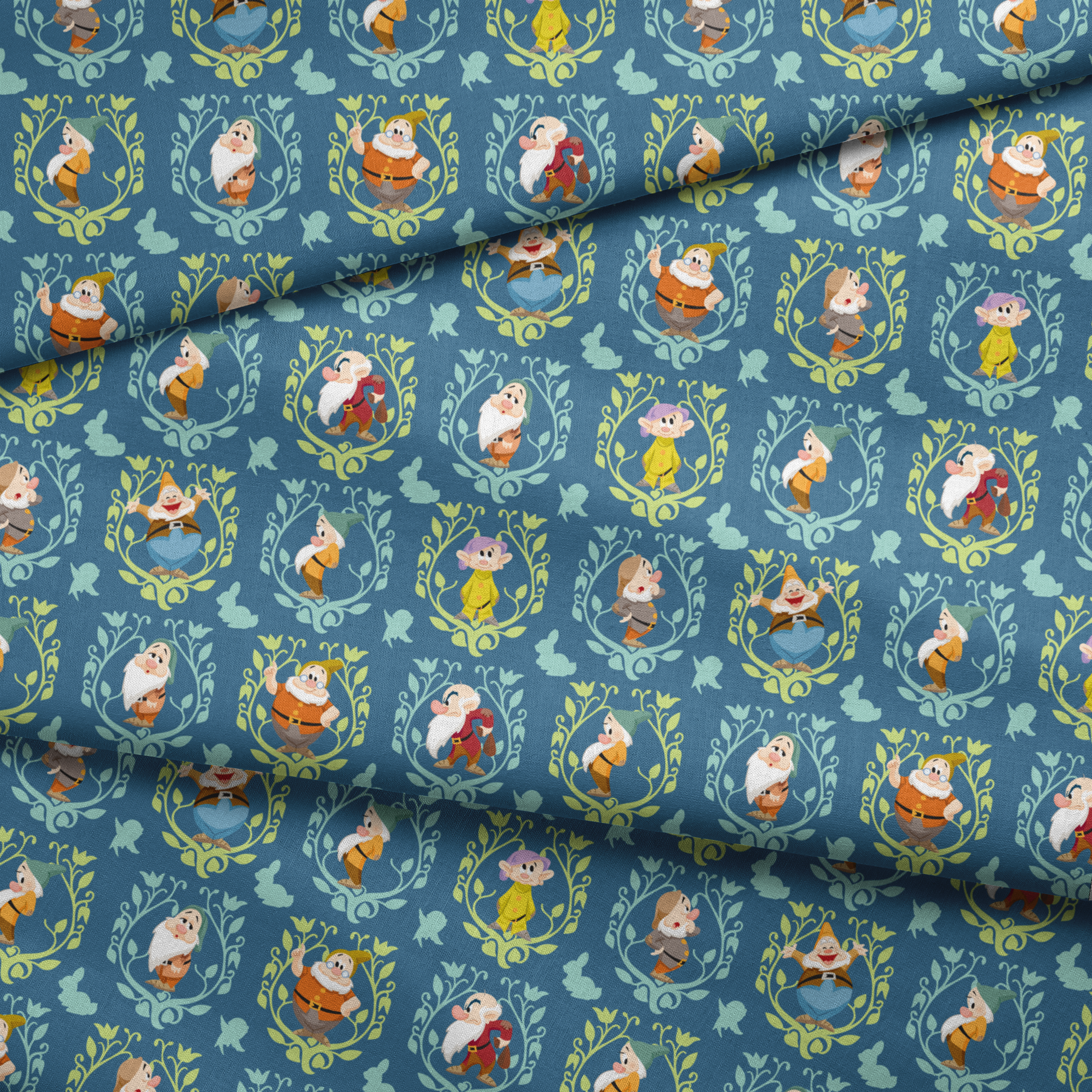 Pattern of cartoon birds in decorative oval frames on blue background with leaf motifs fabric fold mockup