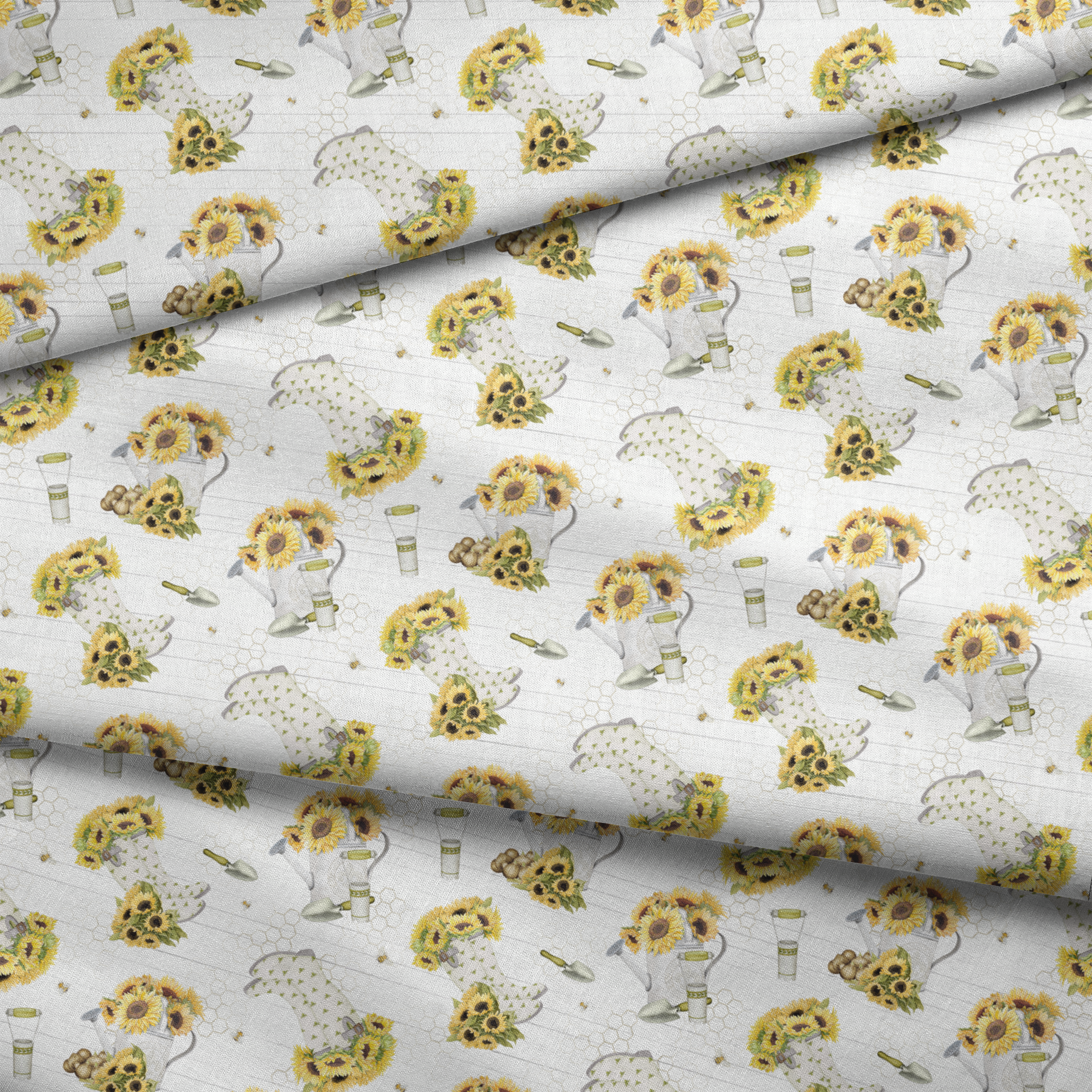 Sunflower-filled watering cans with bees, trowels, and garden tools on a white shiplap and honeycomb background. Designed by Nicole Tamarin. fabric fold mockup