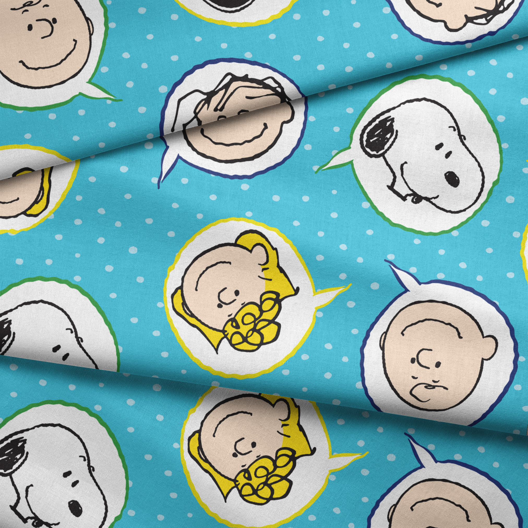 Peanuts characters pattern with Snoopy and other cartoon faces in circles on blue background fabric fold mockup
