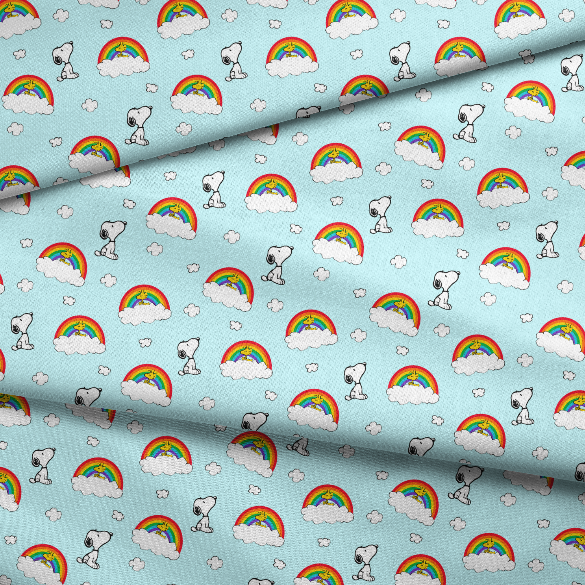 Snoopy and Woodstock characters on light blue background with rainbows, clouds and white fluffy clouds fabric fold mockup