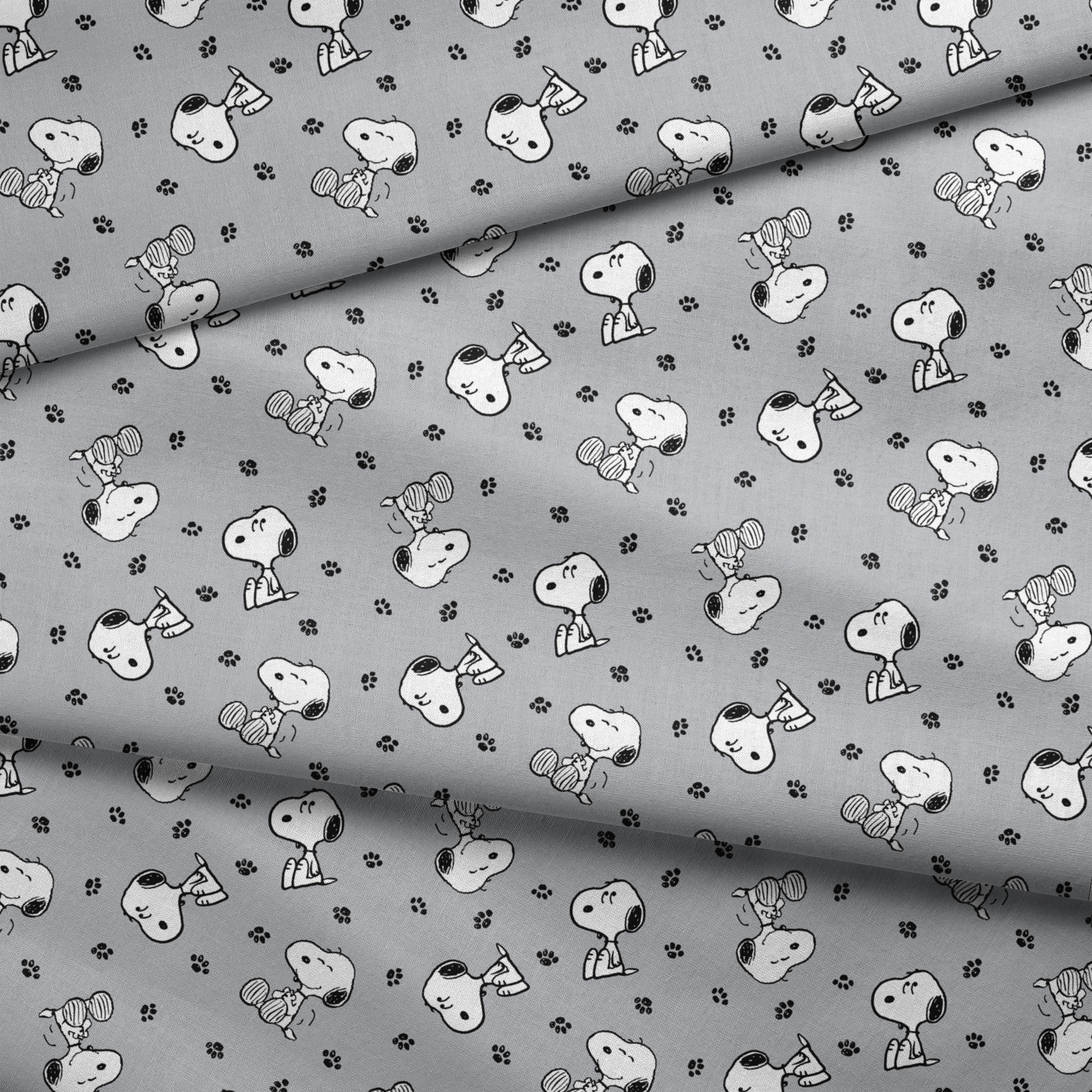 Snoopy with black ears on gray background with paw prints, in various poses fabric fold mockup