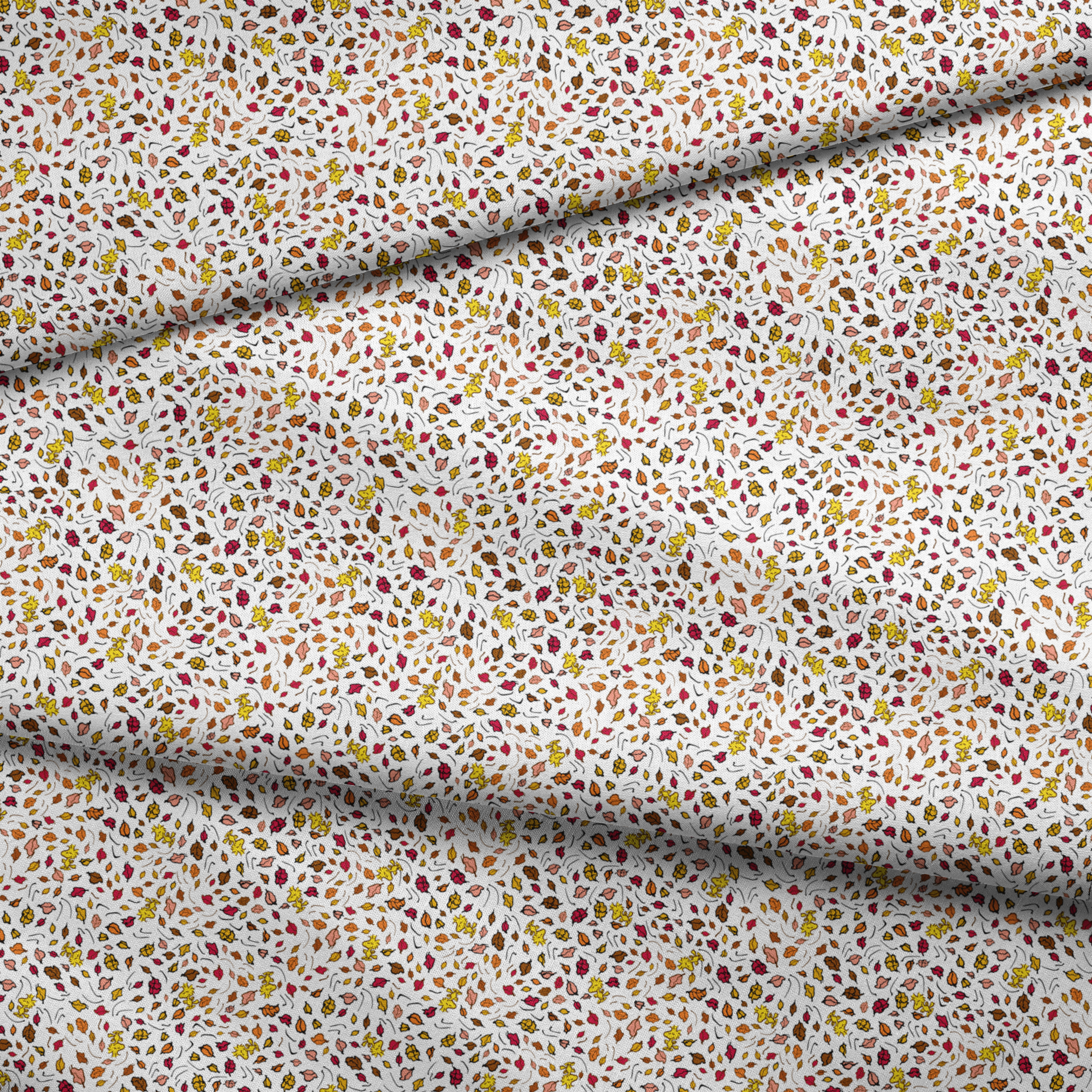 Colorful Peanuts autumn leaves pattern with Woodstock and yellow, red, and brown foliage scattered on white background fabric fold mockup