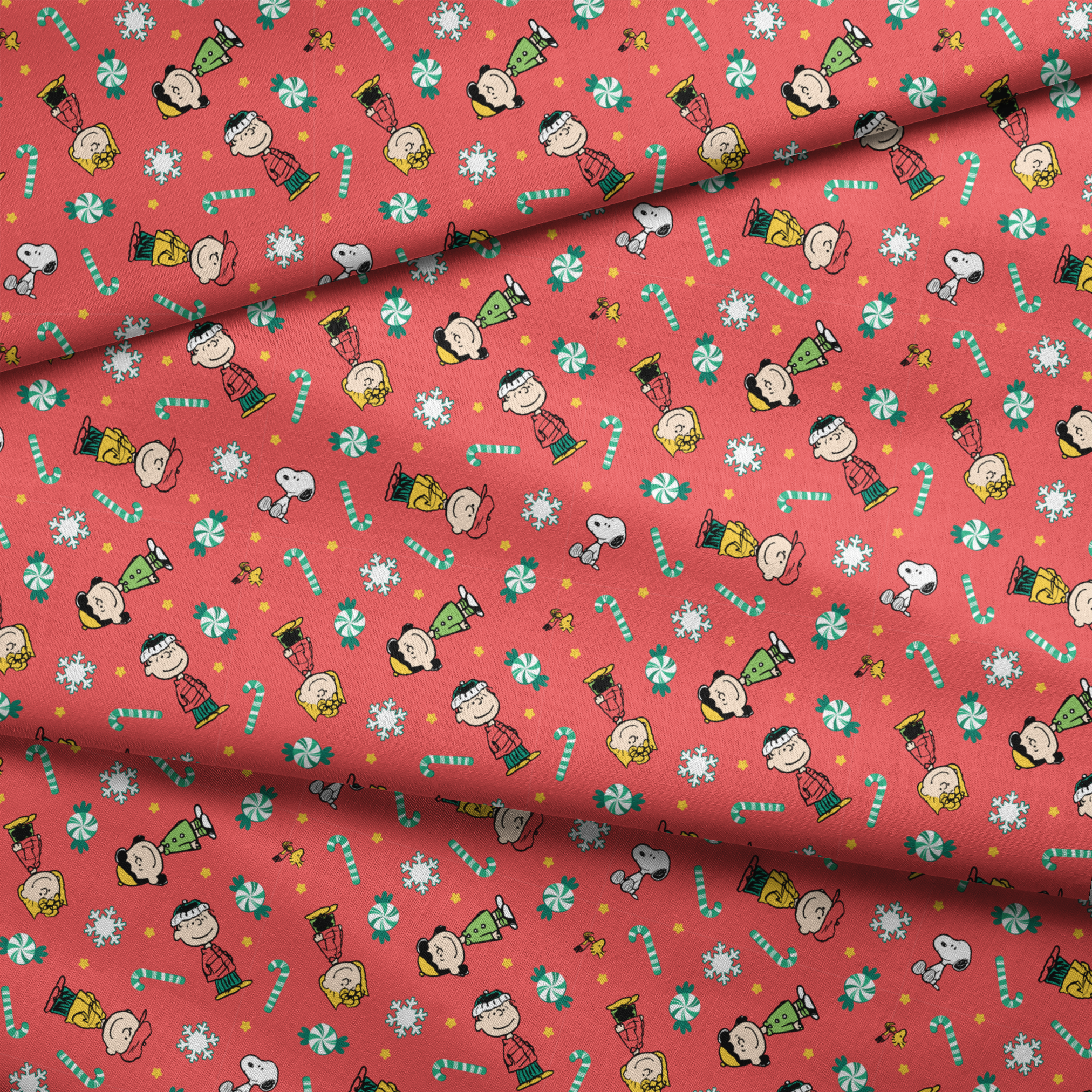 Festive Peanuts cartoon pattern with Charlie Brown characters, candy canes, snowflakes, and peppermints on red background fabric fold mockup