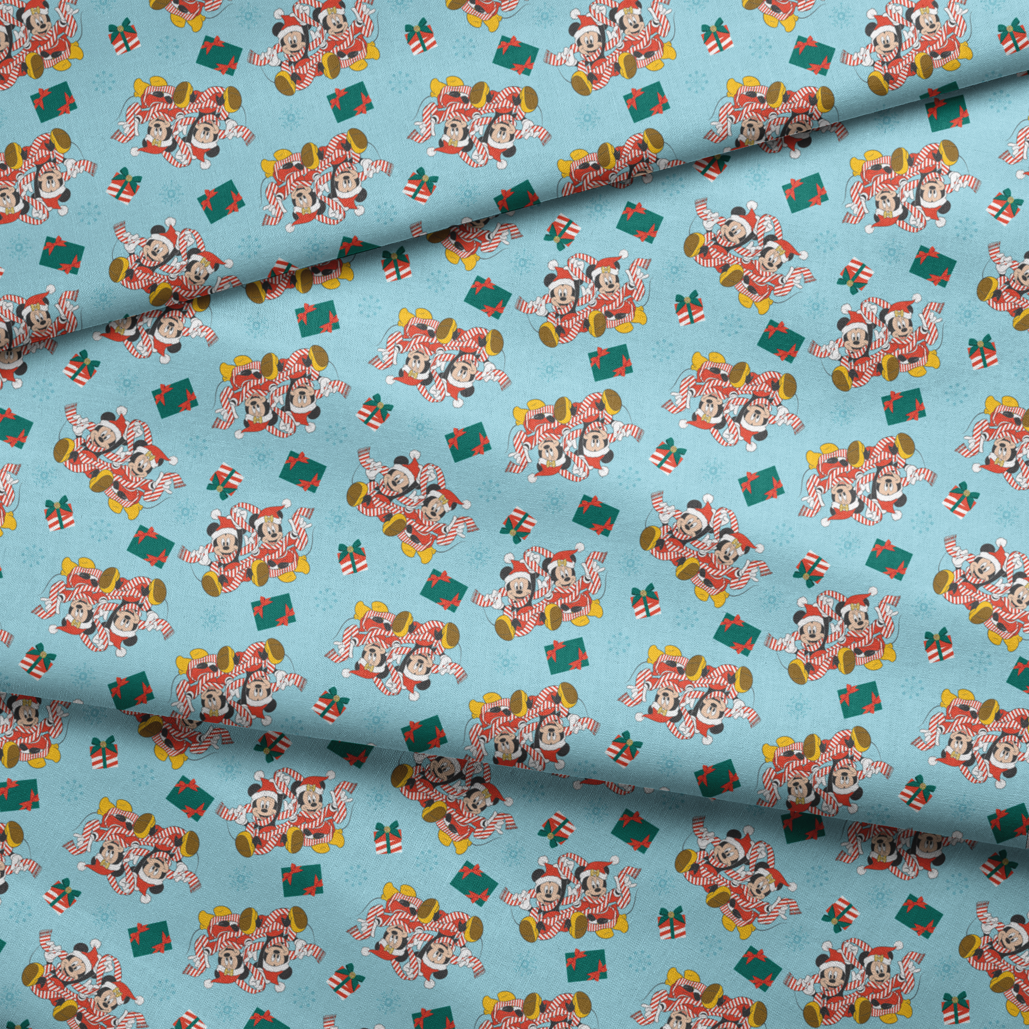 Mickey and Minnie Mouse pattern with candy stripe pajamas, presents, and snowflakes on light blue background fabric fold mockup