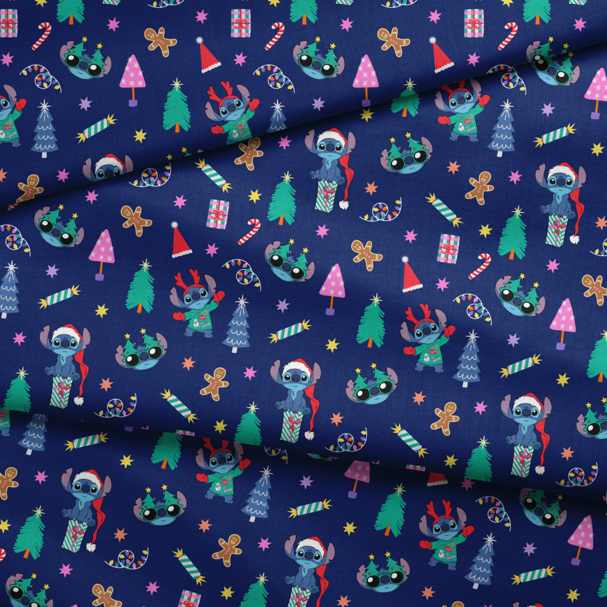 Festive Christmas pattern with Stitch, trees, candy canes, presents, and gingerbread men on navy background fabric fold mockup