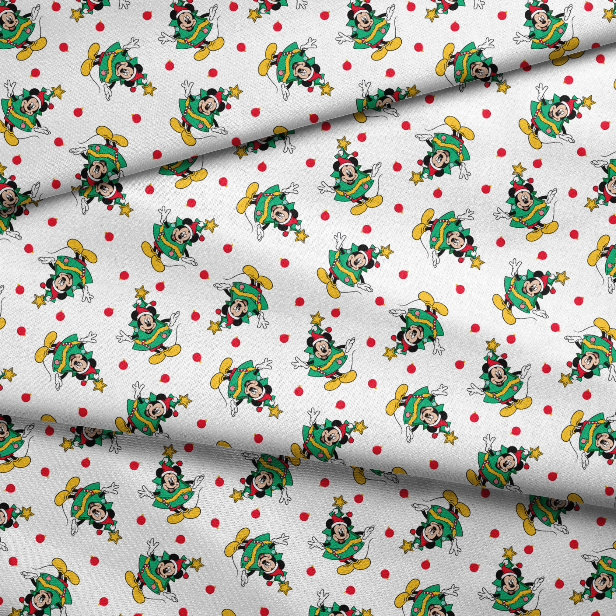 Mickey Mouse in a Christmas tree costume and stars on white background with red dots fabric fold mockup