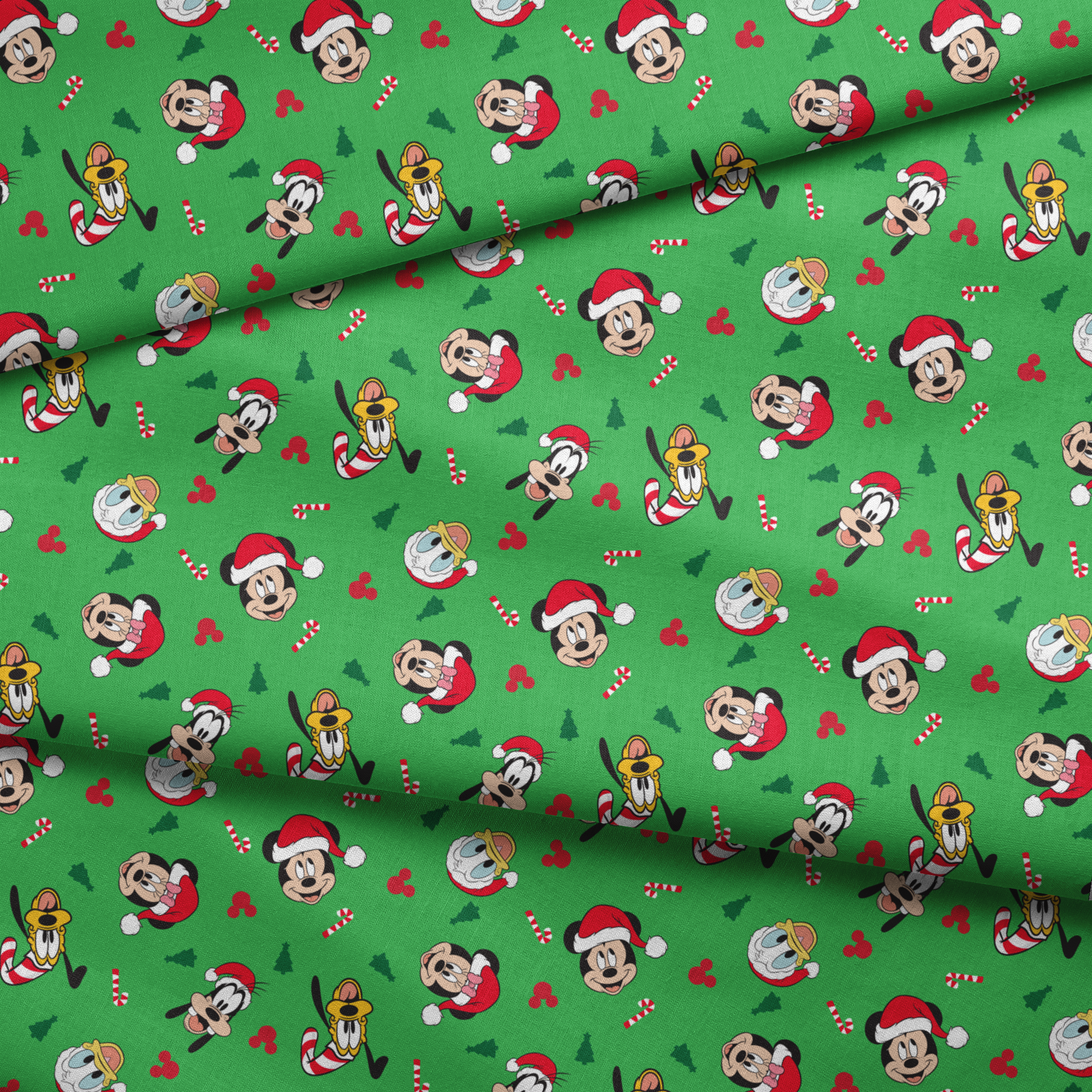 Disney Mickey Mouse characters in Santa hats on green background with candy canes and Christmas trees fabric fold mockup