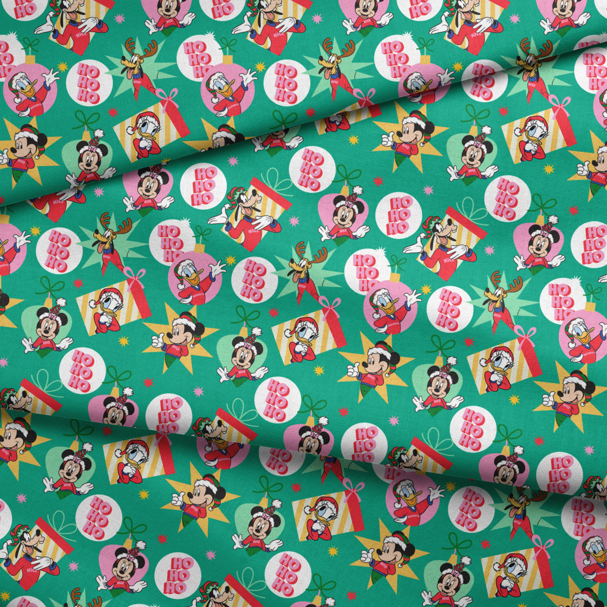 Festive Disney characters on green holiday pattern with "Ho Ho Ho" text and Christmas ornaments fabric fold mockup