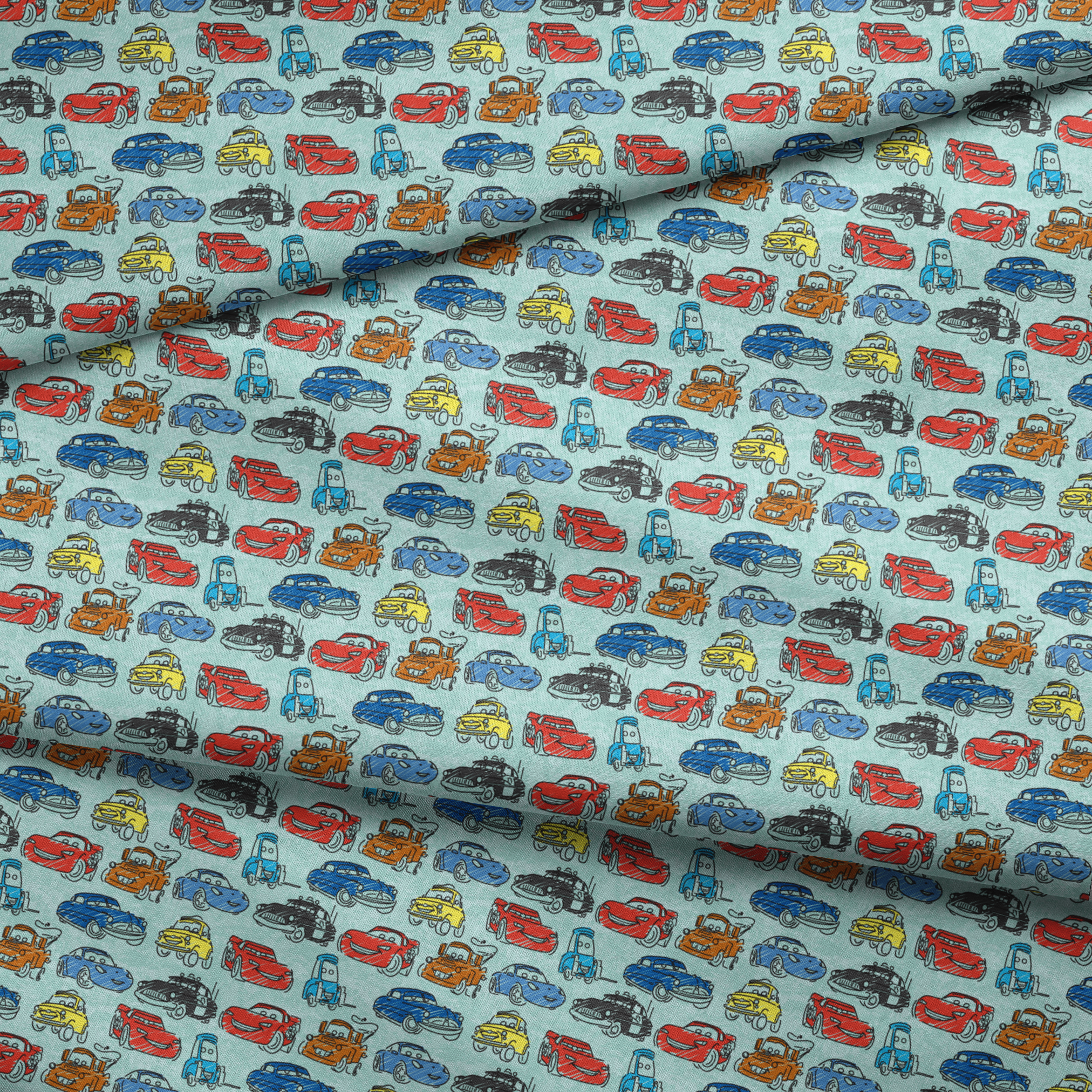 Colorful cartoon cars pattern including red racecars, blue sedans, yellow coupes, and tow trucks on light blue background fabric fold mockup