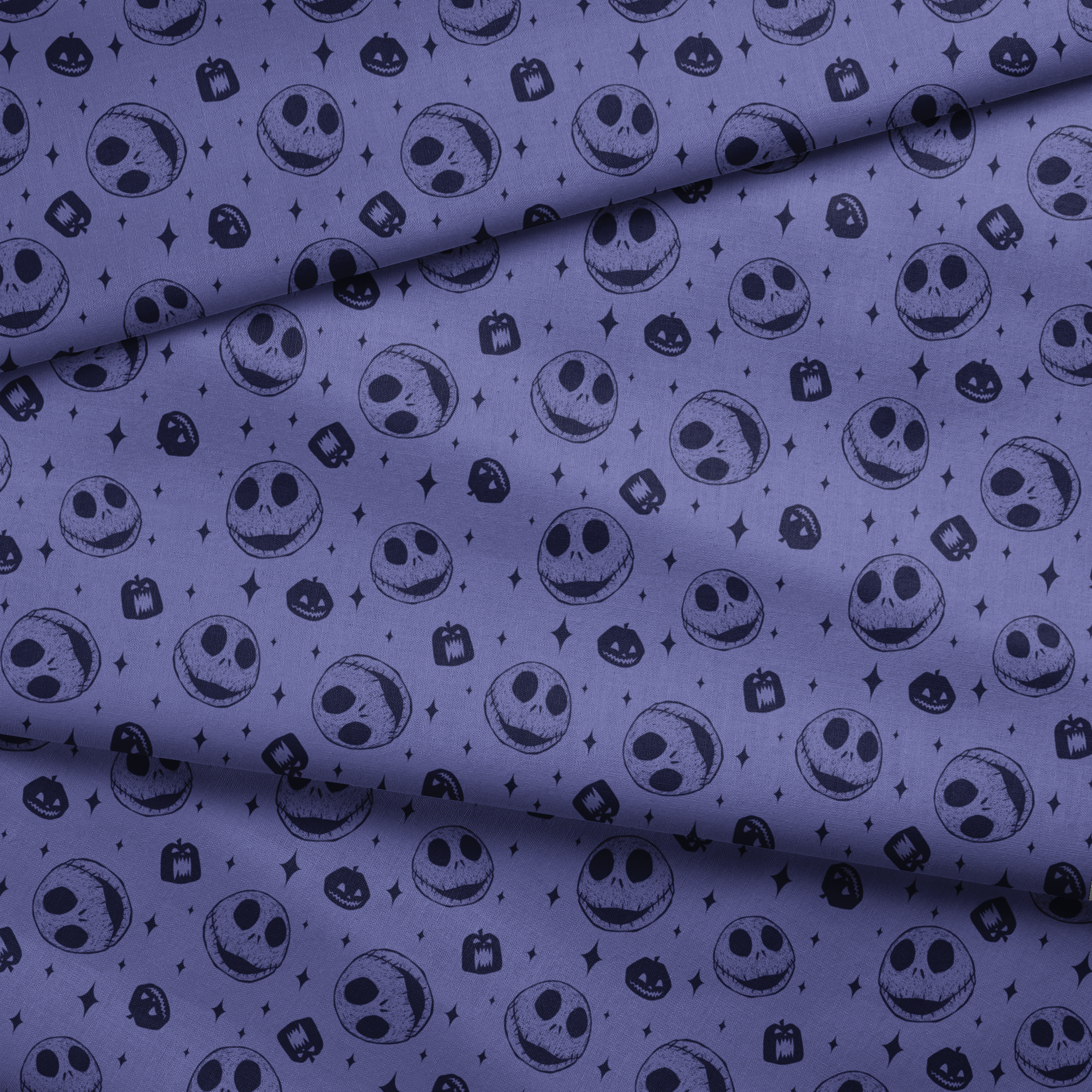 Nightmare Before Christmas skull and pumpkin pattern on purple background with black star shapes fabric fold mockup