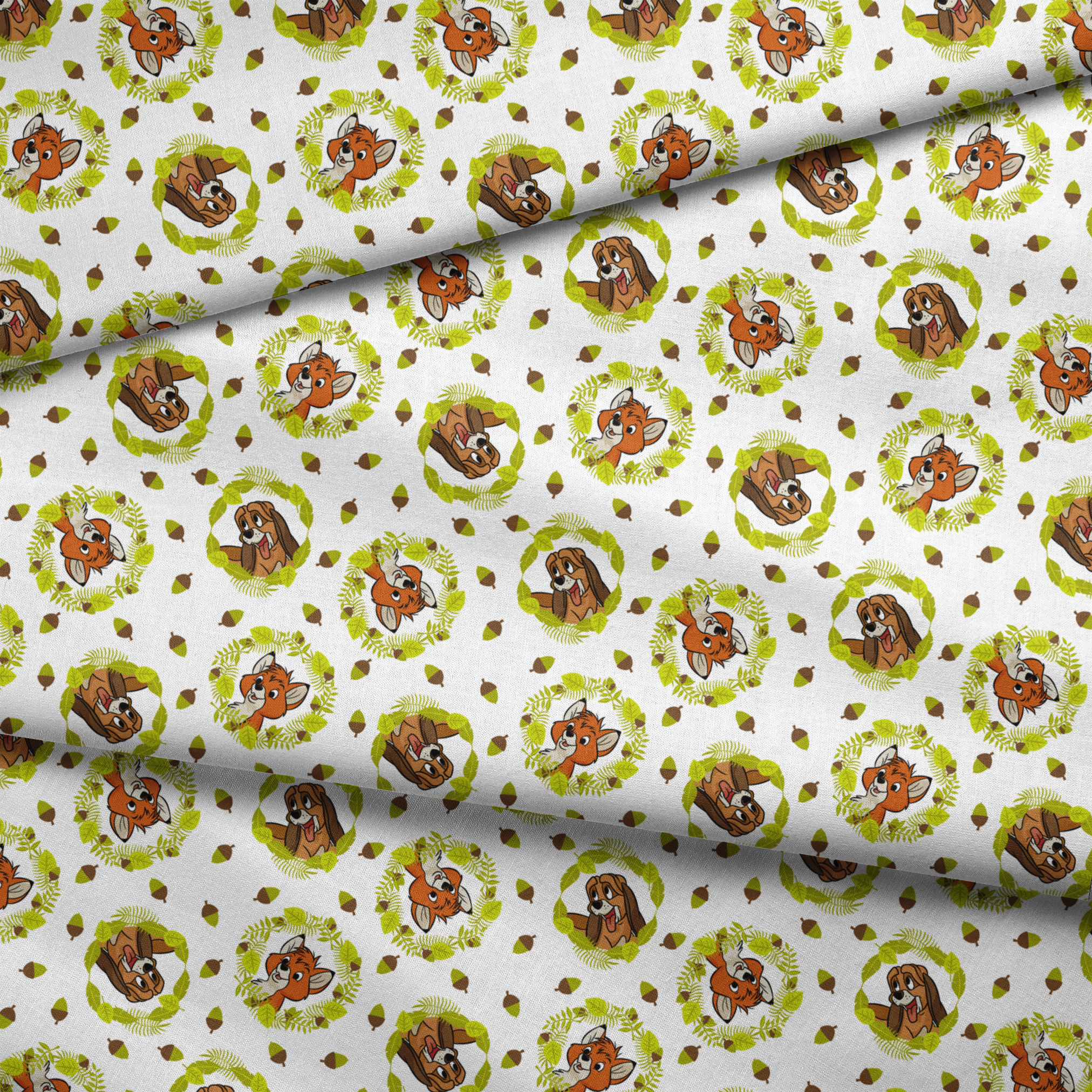 Fox and the Hound characters in green leafy wreaths with scattered acorns on white background fabric fold mockup